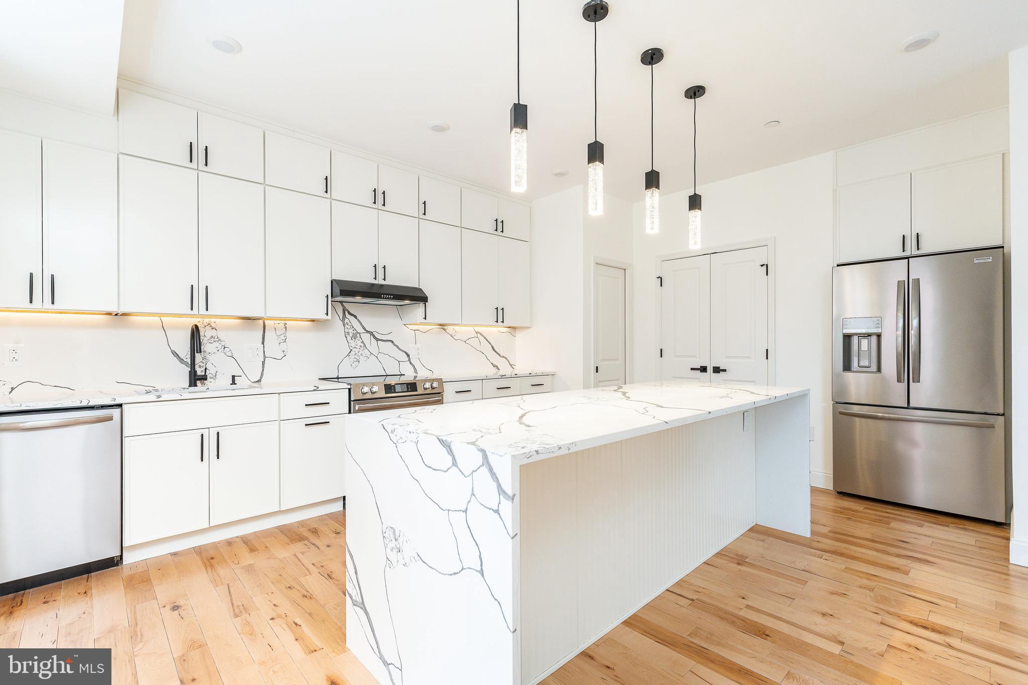 Welcome to 106 Pollard Street, a 38-foot-wide new construction home in the heart of Northern Liberties offering over 3,100 square feet of thoughtfully designed living space. With 3 bedrooms, 4 full baths, 2 powder rooms, a finished basement, an designated office space and a one-car garage, this home offers the size and layout buyers rarely find at this price point.

Step inside to wide-plank hardwood floors and an open, airy layout built for both everyday living and entertaining. The kitchen is the centerpiece of the home, featuring a large waterfall island, clean modern finishes, and plenty of space to host without feeling crowded.

The full-floor primary suite provides a true retreat, complete with a spacious layout and a spa-like bathroom featuring a freestanding soaking tub, dual vanities, and a separate water closet.

Upstairs, you’ll find two additional well-sized bedrooms, while the main level offers a flexible room that works perfectly as a home office or guest space.

The finished basement, complete with a full bathroom, adds even more versatility — ideal for a second living area, gym, or extended guest setup.

Head up to your private rooftop deck with a wet bar and take in sweeping city views — an ideal space for relaxing or entertaining.

Additional features include an attached one-car garage, tankless water heater, dual HVAC systems, generous storage throughout, a 10-year tax abatement, and a 1-year builder warranty.

Located in Northern Liberties, you’re just steps from The Piazza, Liberty Lands Park, and The Fillmore Philadelphia, with easy access to neighborhood favorites like Yards Brewing Company and Frankford Hall. Enjoy one of the city’s most walkable neighborhoods with top dining, coffee shops, and nightlife right outside your door.

With its rare width, functional layout, and prime location, this home delivers exceptional value in one of Philadelphia’s most sought-after neighborhoods.
