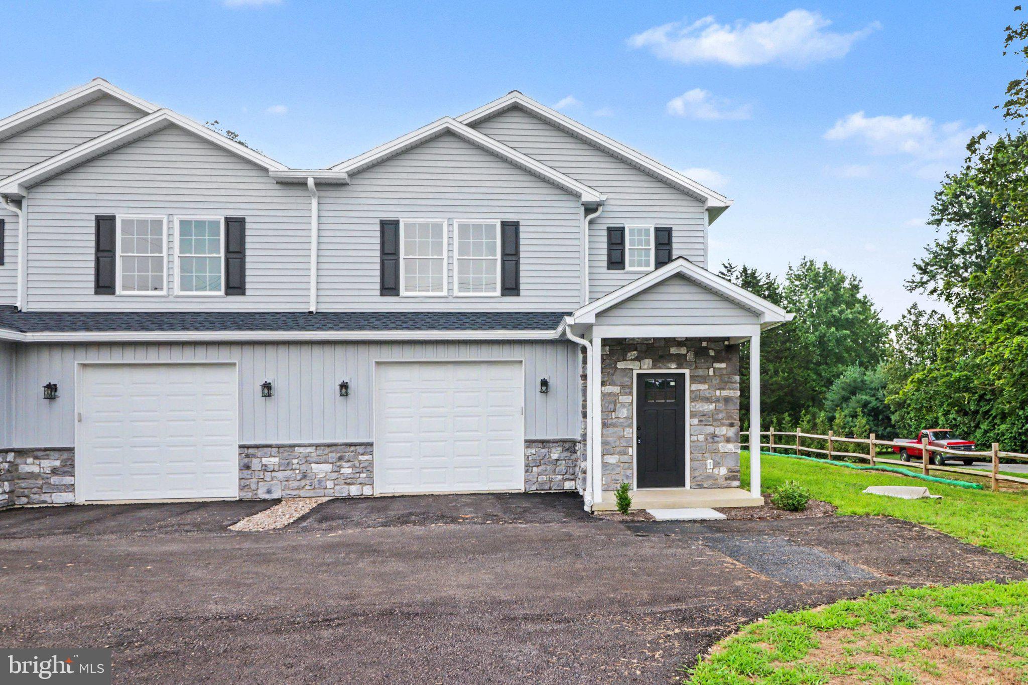 OPEN HOUSE TOMORROW, SATURDAY the 25th from 1-3!!!! Brand new construction by Tiday Bors Homes LLC! Offering over 2,300 square feet of thoughtfully designed living space, this beautiful duplex combines exceptional quality, modern design, and premium finishes throughout. Features include 9 foot ceilings, all wood kitchen cabinetry and bathroom vanities, Level 4 quartz countertops, generously sized bedrooms with walk-in closets, and a convenient second floor laundry room. The primary suite boasts a custom tiled shower with a frameless glass door. Ideally located within walking distance of Northern High School and downtown Dillsburg, this home offers the perfect blend of style, comfort, and convenience while embracing the small-town charm and welcoming community that make Dillsburg such a wonderful place to call home.