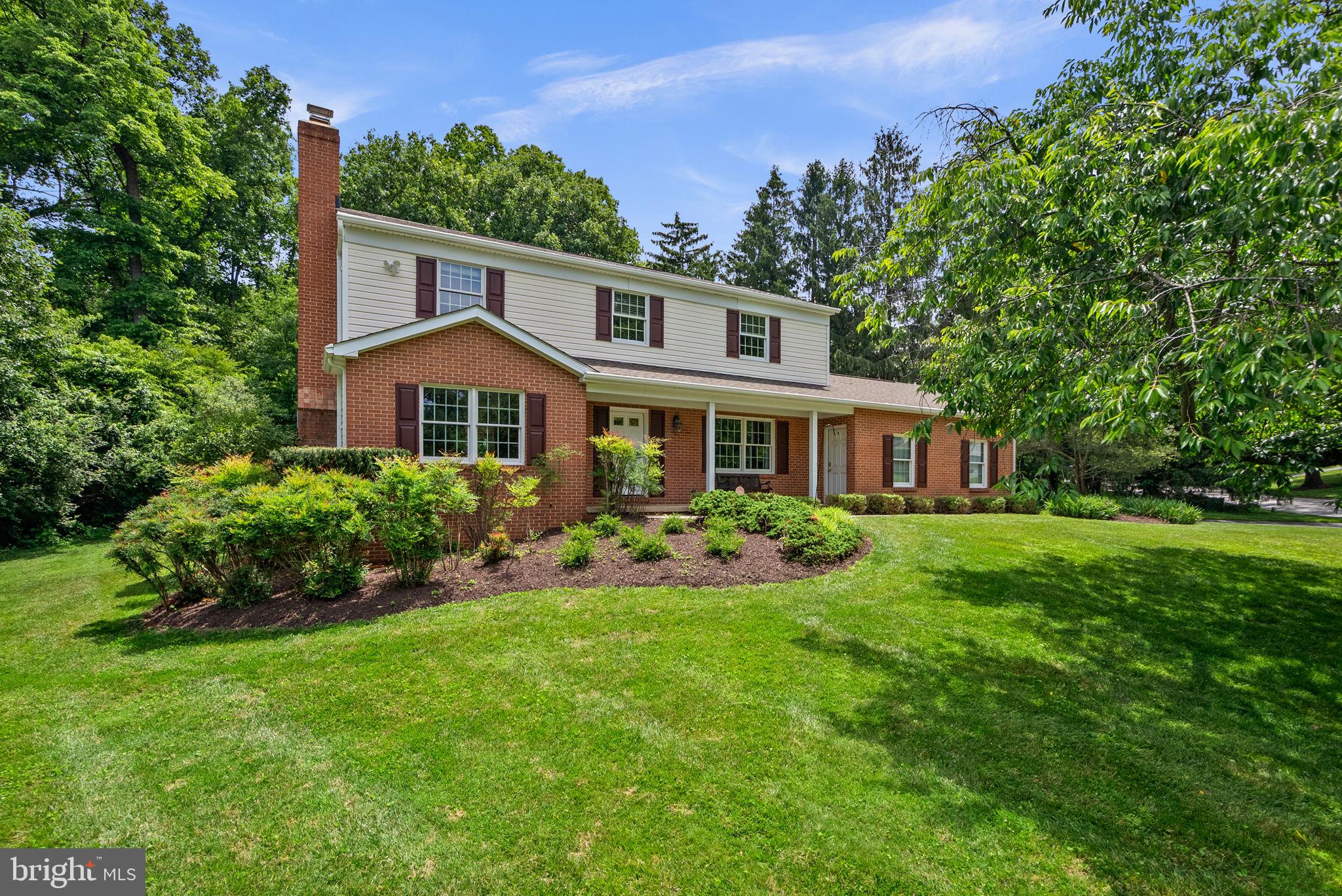 Charming Colonial residence offering 4 bedrooms, 2 full bathrooms, and 1 half bathroom, 3,066 finished square feet, and a 2-car garage on a beautiful homesite of more than half an acre in desirable Font Hill. A lush front lawn, mature landscaping, pathway, and welcoming front porch create exceptional curb appeal. // Inside, hardwood flooring spans much of the home, beginning in the spacious living room, which is filled with natural light and seamlessly connects to the formal dining room, where a classic chandelier provides an elegant setting for gatherings and special occasions. // The eat-in kitchen, updated in 2016, is thoughtfully appointed with stainless steel appliances, granite countertops, a decorative backsplash, rich cabinetry, and a sunny breakfast nook with sliding glass door access to the patio. Conveniently located nearby is the mudroom/laundry room, featuring a washer and dryer replaced in 2025, as well as a powder room. Just off the breakfast area, the inviting family room showcases hardwood flooring and a striking floor-to-ceiling stone wood-burning fireplace, creating a warm and welcoming atmosphere. // The upper level offers four bedrooms and two full bathrooms, with hardwood flooring throughout all bedrooms. The spacious owner's suite serves as a private retreat, complete with a walk-in closet, dedicated vanity area, and an ensuite bathroom. // The fully finished walk-up lower level provides exceptional flexibility with a large open recreation space enhanced by newly installed carpeting, while an oversized utility room offers abundant storage and workshop potential. Additional improvements include an HVAC system and water heater replaced in 2017, along with a roof that is less than 15 years old. // Outdoor living is highlighted by a patio overlooking the backyard, accented by a stone retaining wall and lush shrubbery that create a peaceful and private setting for relaxation and entertaining. As a bonus, the property enjoys proximity to Font Hill Pond, offering scenic views and a tranquil natural backdrop.