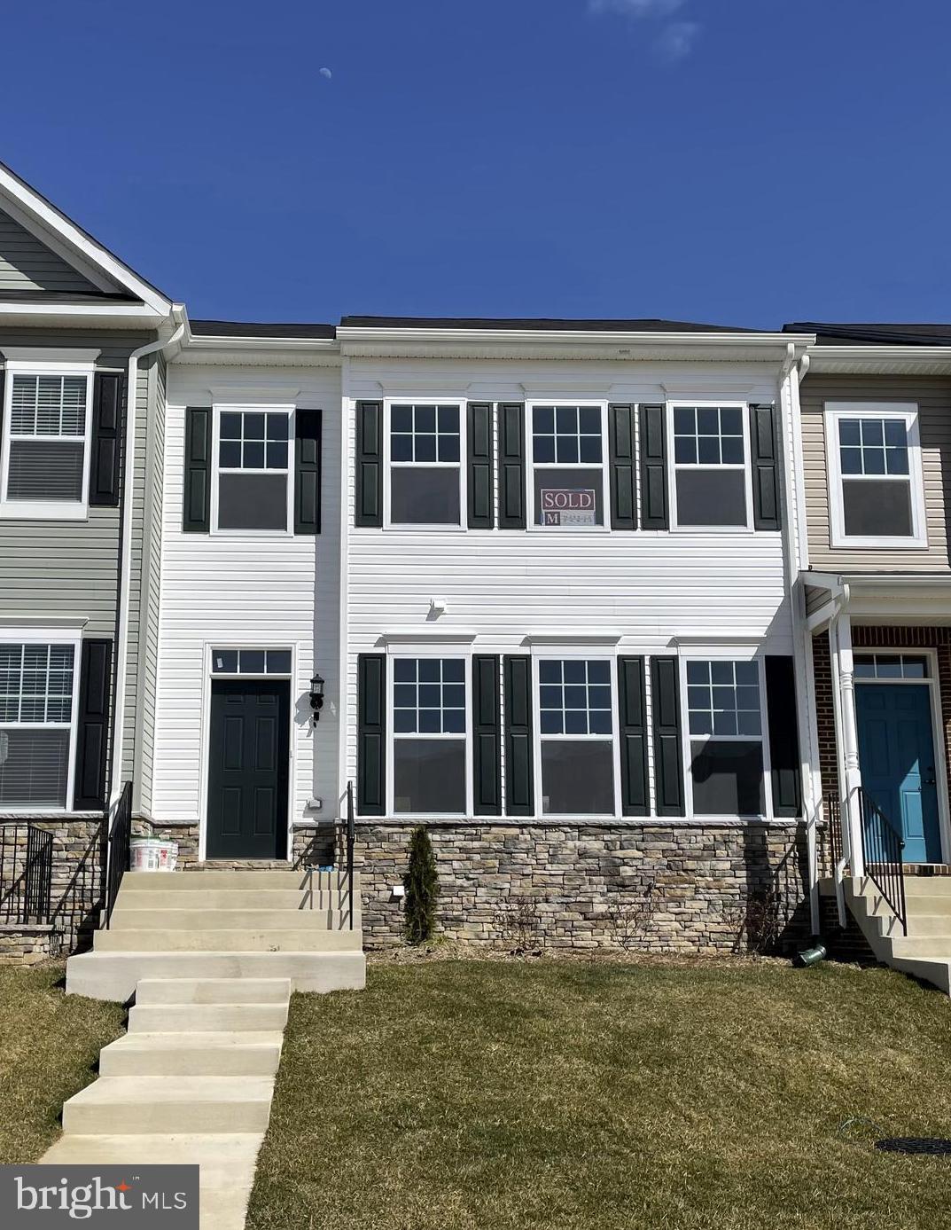 Sold & Settled Compton # 1 Townhome  at the Clark's Rest neighborhood in Leonardtown. This layout is the Compton" Rear Kitchen Model";  featuring a  2-Car Rear Load Garage w. 3 bedrooms/ 3.5 baths with a finished basement rec room and full bath, plus a large 19'6"x12' composite deck off of the kitchen.