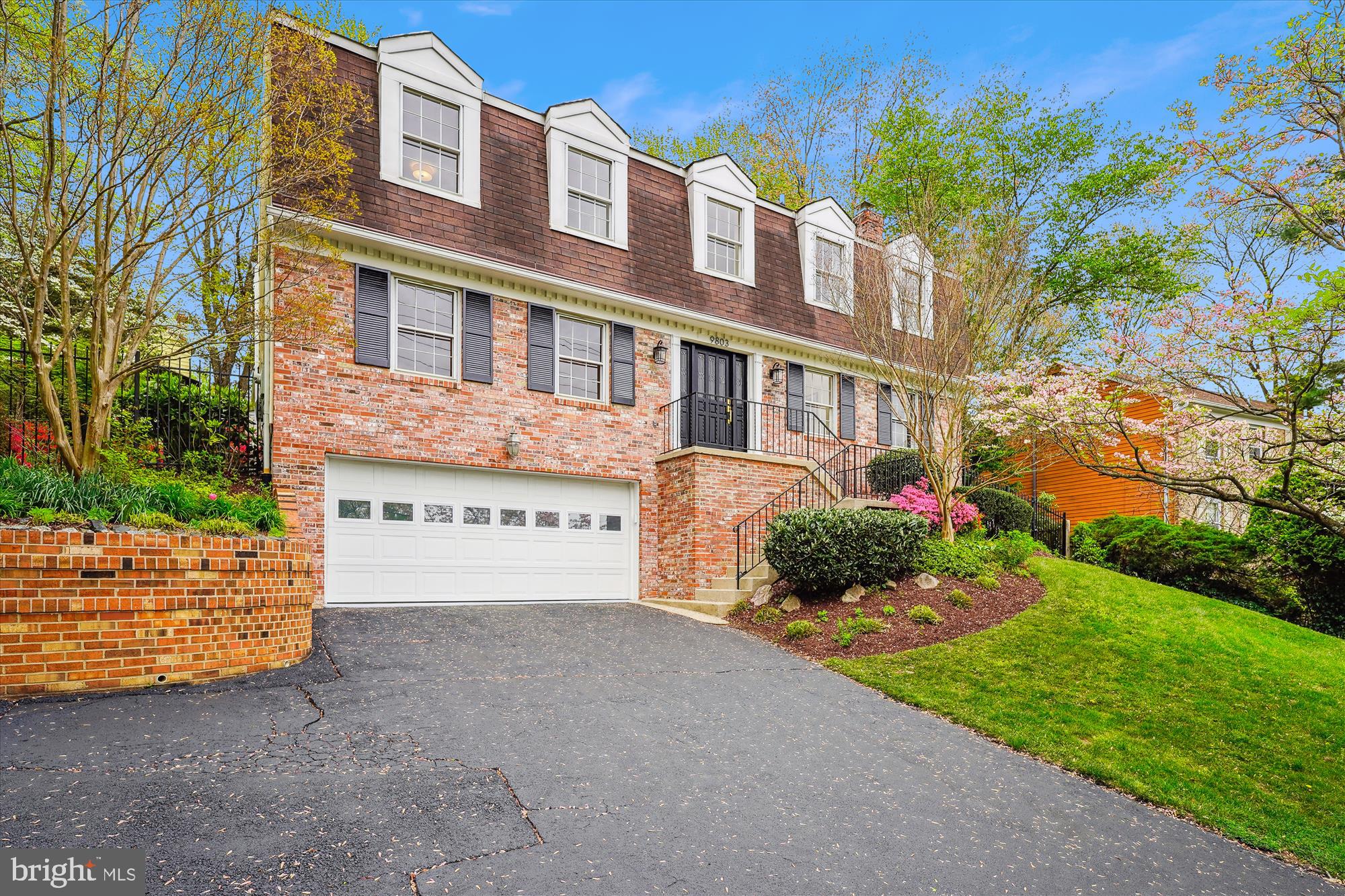 Expanded and beautifully renovated in 2006, this meticulously maintained Handicap Accessible home offers exceptional turn-key living in Rock Creek Hills—one of Kensington’s most desirable neighborhoods. Framed by flowering trees and manicured gardens, its timeless traditional facade and private setting offers a warm welcome.

Step inside to a sun-drenched interior designed with comfort and accessibility in mind, featuring an ELEVATOR to all three levels and wide, low-threshold passageways throughout. Rich hardwood flooring and large windows accent the gracious main level, where a spacious living room opens to the formal dining room, and an expansive family/great room centers around a fireplace with eye-catching ceiling detail. A casual dining nook surrounded by Andersen windows completes the open, airy feel.

The kitchen flows seamlessly into the great room and is outfitted with a peninsula with bar seating, ample counter and cabinet space, and a convenient pantry—perfect for busy daily living and entertaining alike. Just off the kitchen, you’ll find a built-in computer station and a private home office with its own fireplace, that can also be another bedroom if needed. Two powder rooms and the ability to convert one into a full bath or main floor laundry adds convenience to the main level.

A door off the main hallway leads to an expansive Trex deck with both covered and open-air sections—ideal for outdoor dining or relaxing while enjoying the fenced in and peaceful rear yard.

Upstairs, four comfortable bedrooms all feature new carpeting and updated lighting. The hall bath includes double sinks, while the primary suite offers a refreshed en-suite bath and two closets.

The walk-out lower level adds valuable flexible space with a recreation room, another full bath, a dedicated laundry room, and access to the oversized two-car garage.

Ideally located just moments from Kensington’s vibrant restaurants, shopping, and top-tier public and private schools, this home also enjoys direct access to biking and walking trails into Rock Creek Park—right down the street.

With its classic charm, thoughtful updates, and pristine condition, this home is a rare offering and an outstanding canvas for modern Kensington living.
