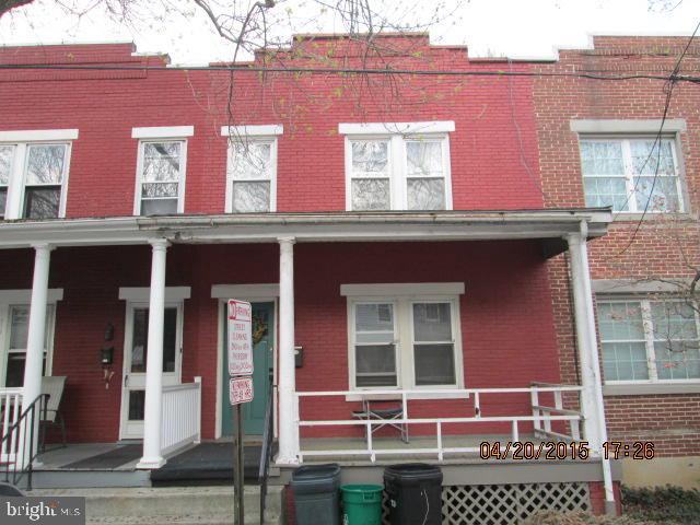 Brick row home within walking distance to parks and schools. Features 3 bedrooms, formal dining area and full basement with entrance to fenced rear yard. Home needs some TLC.