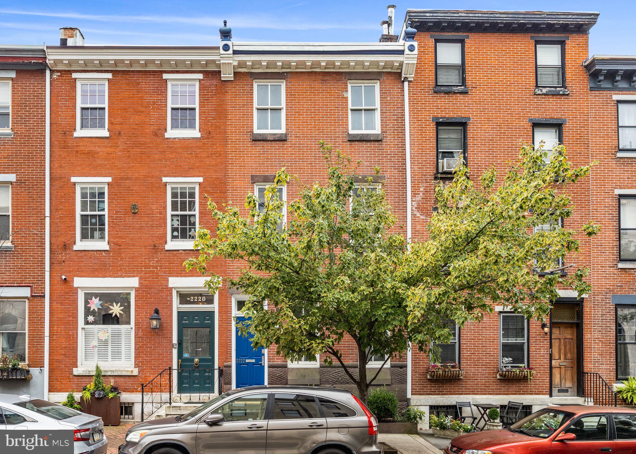 FITLER SQUARE townhouse with PARKING on a rare 100 ft deep lot! This charming townhouse spans over 2700 SF across four levels of living, offering three bedrooms - each with an en-suite bathroom - with two half bathrooms, a finished basement, sauna, and large garden plus 1-car covered parking. The first level features a spacious living room with high ceilings, wood floors, and a fireplace, adjacent to the separate dining room and kitchen. There is also a conveniently located powder room. The kitchen features stainless steel appliances, Downsview cabinetry, and oversized windows that look out to the garden. The garden offers plenty of room for outdoor entertaining, alfresco dining, and access to the covered parking and Latimer Street. The second level provides two-bedroom suites. The south-facing bedroom features a built-in bed and wardrobe, with an en-suite bathroom which includes a large soaking tub, single vanity sink, and stall shower. The primary suite is also on this level and features large custom closets and an en-suite bathroom with a double vanity sink and glass-enclosed shower. The 3rd floor is a large loft-like bedroom with vaulted ceilings and an attached bathroom with a single vanity, sink, and stall shower. Completing this home is a finished basement with a carpeted den/playroom with built-in bookshelves, storage, powder room, and a built-in sauna. This home is located in the Greenfield Elementary School Catchment and blocks from the green spaces of the Schuylkill River Park, playground, dog parks, and running/walking/biking trail. A short commute to Penn, CHOP, Drexel, and 30th Street Station, and 15 min from the PHL International Airport.