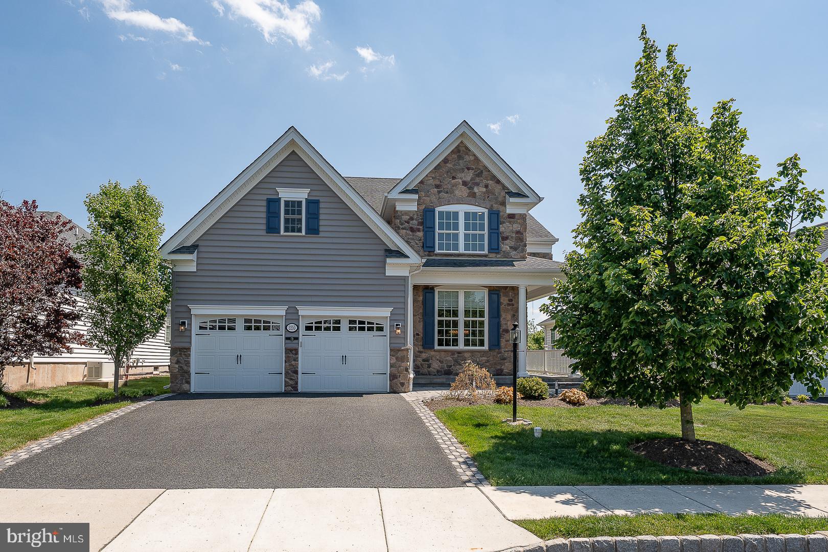 Welcome to 2250 Stockton Drive, a stunning single-family home in the highly desirable Meadow Glen at Skippack, a 55+ community known for its resort-style amenities and vibrant lifestyle. This spacious 4 Bedroom, 3 Bath residence offers 2,291 square feet of thoughtfully designed living space with over $100,000 in recent upgrades and improvements.
The home makes a striking first impression with its dramatic architectural design, accentuated by soaring two-story and vaulted ceilings throughout the main living areas. The impressive two-story Entry, Formal Living Room, Dining Room, and expansive Family Room create a unique, open, and airy atmosphere filled with natural light and a wonderful sense of space. Hardwood flooring, elegant lighting, and thoughtfully updated finishes further enhance the home’s warm yet sophisticated feel.
The upgraded Kitchen is designed for both everyday living and entertaining, featuring shaker-style cabinetry, granite countertops, stainless steel appliances including a GE Profile double oven with convection, a large peninsula with seating, tile backsplash, pantry storage, and a bright Breakfast Area with sliding doors leading to the patio. Open to the Kitchen, the stunning vaulted Family Room features hardwood floors and a striking double-sided gas fireplace shared with the Primary Suite. The first-floor Primary Bedroom includes a tray ceiling, new carpeting, a large walk-in closet, direct access to the patio, and a spa-inspired Bath with heated floors, soaking tub, dual vanity, and tiled shower. The second Bedroom, also located on the main level, is currently being used as a private Home Office and features custom-built cabinetry and a closet, offering flexibility to suit a variety of needs. A Full Bath and Laundry Room with direct access to the Garage complete the first floor. Upstairs, the spacious loft has a 2-story view of the main living area and an abundance of natural light. This floor also offers two generously sized Bedrooms and a Full Bath, creating comfortable accommodations for guests, hobbies, or additional living space.
Recent improvements reflect the owner’s attention to detail and commitment to quality, including complete interior painting of the walls, trim, ceilings, doors, exterior shutters, and front door. Additional upgrades include Hunter Douglas Duette shades throughout the home, a new GE Profile double oven with convection feature, new LG washer and dryer, upgraded high-horsepower garbage disposal, Ethan Allen chandelier in the Breakfast Area, Ethan Allen custom draperies in the Primary Bedroom and Family Room, and new carpeting in the Primary Suite. Thoughtful design updates throughout the home created a more clean, modern transitional aesthetic with enhanced openness and improved flow between the main living spaces, including the dramatic expansion of the opening between the Dining Room and Kitchen to create a brighter and more connected feel.
Outdoor living is equally impressive with a paver-lined driveway, landscaped grounds, a private stone patio with a gas hookup for grilling. The oversized two-car Garage includes a large and convenient Attic storage access.
Residents of Meadow Glen enjoy exceptional amenities including a clubhouse, fitness center, outdoor pool, walking trails, bocce courts, dog park, pavilion, and a full calendar of clubs, activities, and social events. Conveniently located near the shops and restaurants of Skippack Village, as well as Routes 422 and the Pennsylvania Turnpike, this move-in ready home offers low-maintenance living in a sought-after community setting.