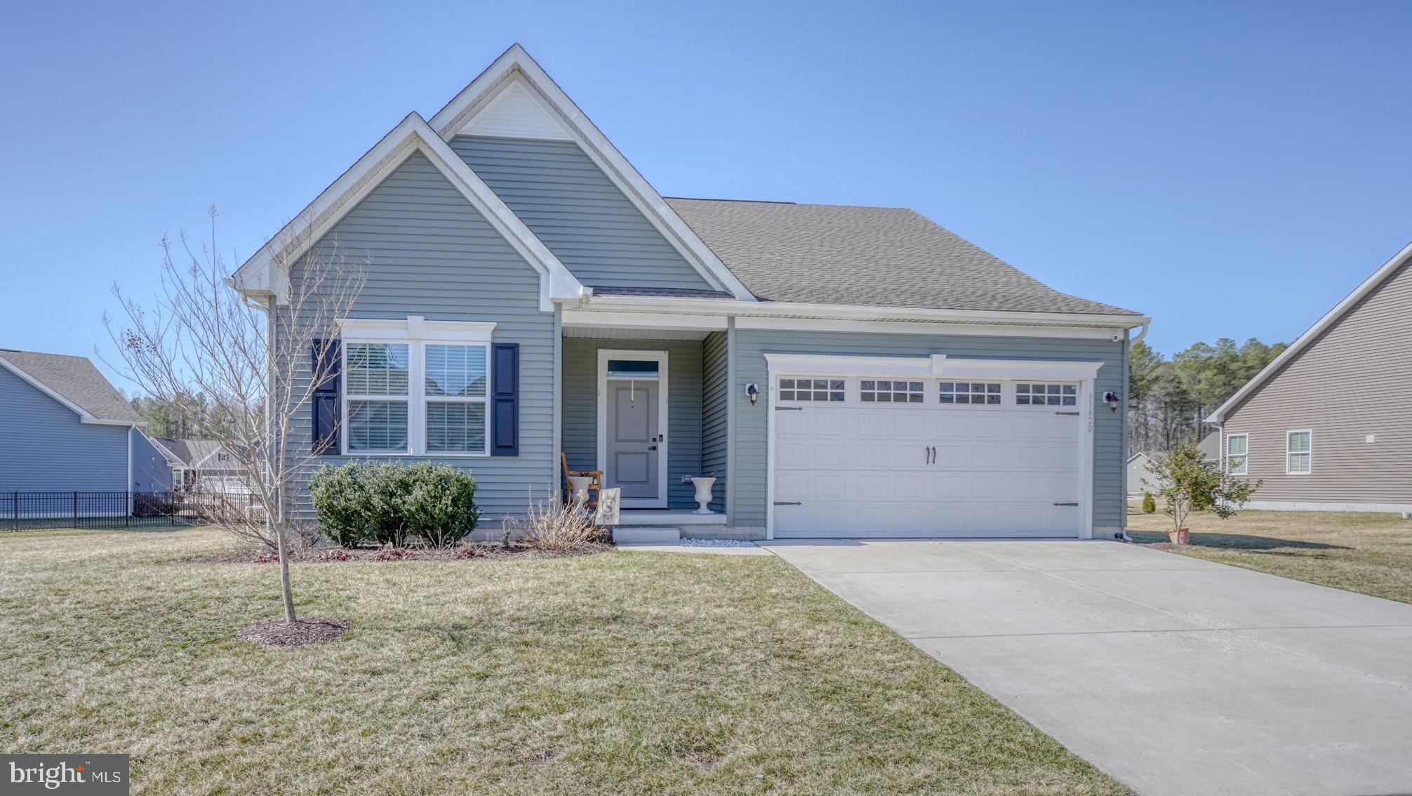 Discover this beautifully upgraded Bramante 2-Story model in the sought-after community of Spring Breeze, located within the highly desirable Cape Henlopen School District. Built in 2022, this nearly new 3-bedroom, 3 full bath home offers over 2,300 square feet of thoughtfully designed living space, including a dedicated office/flex room and numerous custom upgrades throughout. Step inside to an inviting open-concept floor plan featuring 10-foot ceilings, luxury vinyl plank flooring throughout the main living area and kitchen, and a bright great room anchored by a cozy gas fireplace. The well-appointed kitchen features stainless steel appliances, gas range cooking, quartz countertops, a pantry, and a large island with bar seating, making it ideal for both everyday living and entertaining. The spacious breakfast area opens to the covered rear porch, creating the perfect space for morning coffee or relaxing evenings outdoors. The privately situated primary suite offers a spacious retreat with an oversized walk-in closet, double vanity, and a large tiled shower. A first-floor guest bedroom and full bath provide comfort and privacy for visitors, while the flex room is ideal for a home office, den, or could easily be converted into a 4th bedroom. Upstairs, a generous loft area provides additional living or recreational space, along with another guest bedroom featuring a walk-in closet and full bath. A large walk-in attic storage room completes the second level. Residents of Spring Breeze enjoy community amenities including a pool, clubhouse, and fitness room, and lawn care is included in the HOA dues for added convenience. This secluded woodland community offers peaceful surroundings while remaining just 10 miles from downtown Lewes and Rehoboth Beach, where you can enjoy tax-free shopping, award-winning dining, and Delaware’s beautiful beaches. Don’t miss this opportunity to own a piece of coastal Delaware living.