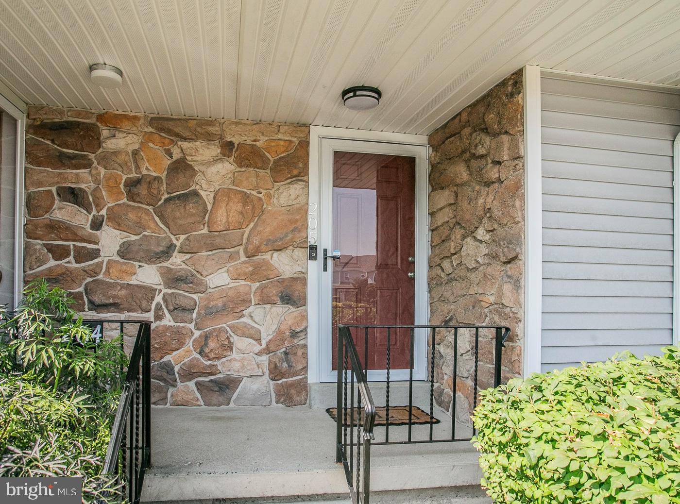 Welcome to 205 Tupelo Grove, a beautifully appointed  townhome nestled in the desirable Stuart Creek Farms neighborhood.   This home was totally renovated in 2023 with new roof, siding, windows, and HVAC system.  The kitchen boasts  luxurious upgrades such as granite countertops and high-end stainless steel appliances.   Enter the front door and you will be greeted by an open floor plan, where a spacious living room seamlessly connects to a built in bookshelf, a convenient first floor powder room, and a bright eat-in kitchen with wood burning fireplace.  Off the kitchen is a spacious deck, offering a private outdoor haven enclosed by charming privacy fencing.  Venture upstairs to discover two generously sized bedrooms, each with its own attached full bathroom.  The thoughtful reconfiguration of this level has expanded closet space and added square footage to the bathrooms.  The real bonus on this level is a "bonus room", complete with window and closet, making it perfect for an office, craft/play room, or nursery.  Completing this level is a convenient second floor laundry.  This home has all new custom window treatments, hardwood floors throughout the first floor and carpeting on the second floor.  A full, dry, unfinished basement provides additional storage space and the possibility for additional living space.  Located in the award winning Upper Dublin School District and conveniently close to major routes and regional rail lines as well shopping and dining in the varied restaurants and shops of downtown Ambler.  Schedule your showing today, and make 205 Tupelo Grove your new home!