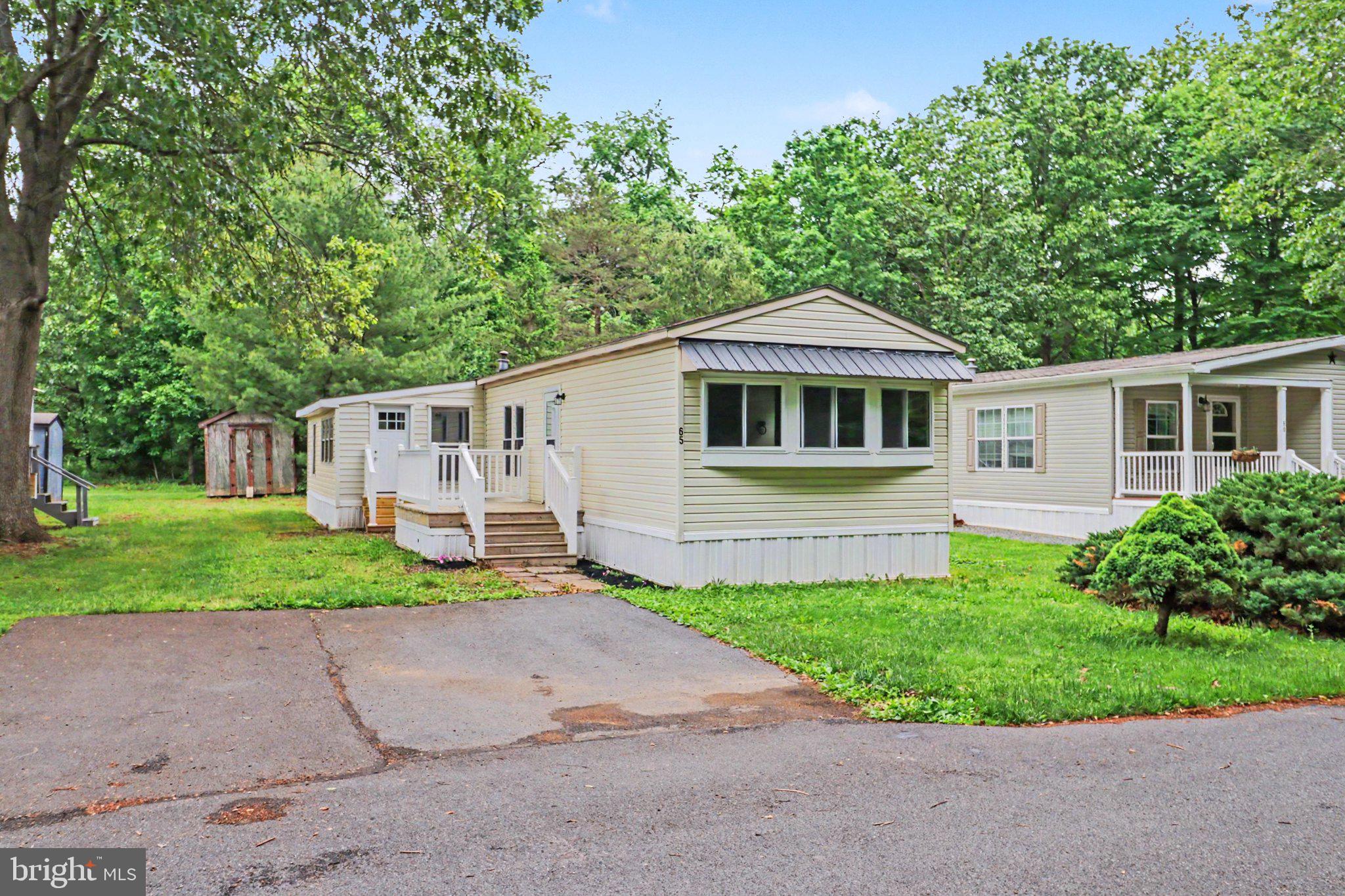 Welcome to this charming 1980 Redman mobile home located in the highly desirable Halifax Village in Halifax, PA! This home features 1244 square feet of comfortable living space with custom live-edge counters that are sure to spark conversation. As you enter the home, you'll be greeted by a spacious kitchen that includes a stove-oven combo and an indoor grill, perfect for cooking and entertaining guests. The master bedroom boasts a beautiful view of open space and pine trees and comes with its own bathroom featuring a relaxing jetted tub. The second bedroom also has a convenient full bath with a walk-in shower for added comfort. This home offers two living areas, one carpeted and the other with sturdy LVT flooring, giving you ample space to enjoy family gatherings or quiet evenings alone. Don't miss out on this fantastic opportunity to own this beautiful mobile home in the heart of Halifax Village! Contact us today to schedule a tour and make this your new home sweet home.