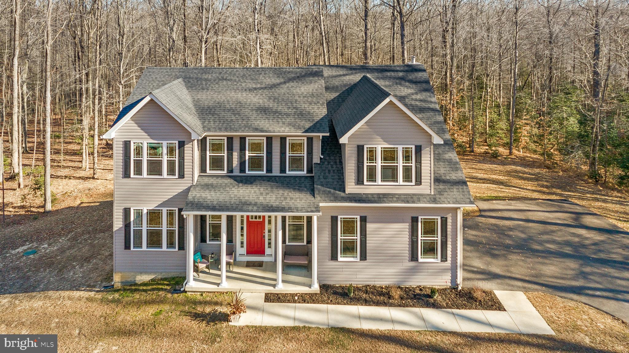 Buyers got cold feet! Back on market!!16 ACRES! LIKE NEW!! Well acquainted 2784 Sqft 2-Story Colonial w/ a 2 car attached garage on 16.33 Acres built in 2017. This home boasts a show stopping open concept on the main floor. While standing in the gourmet kitchen at the 11' working/seating island you can see into the formal dining room, as well as almost 50' across the back of the house through the breakfast area and into the large family room. The kitchen has soft close cabinets, granite countertops, and stainless appliances. All of the flooring on the main floor is a durable luxury vinyl plank. The custom made barnwood fixtures, and built-ins add to the custom feel. Heading out the 8'tall sliding glass door you are greeted by a massive deck that overlooks a wooded paradise. A half bath and mud room finish off this floor. Heading upstairs you will find an owners suite w/ 2 walk-in closets and a luxurious bathroom. Down the hall 3 large bedrooms and a hall bathroom finish off this floor. The unfinished basement has unlimited possibilities!