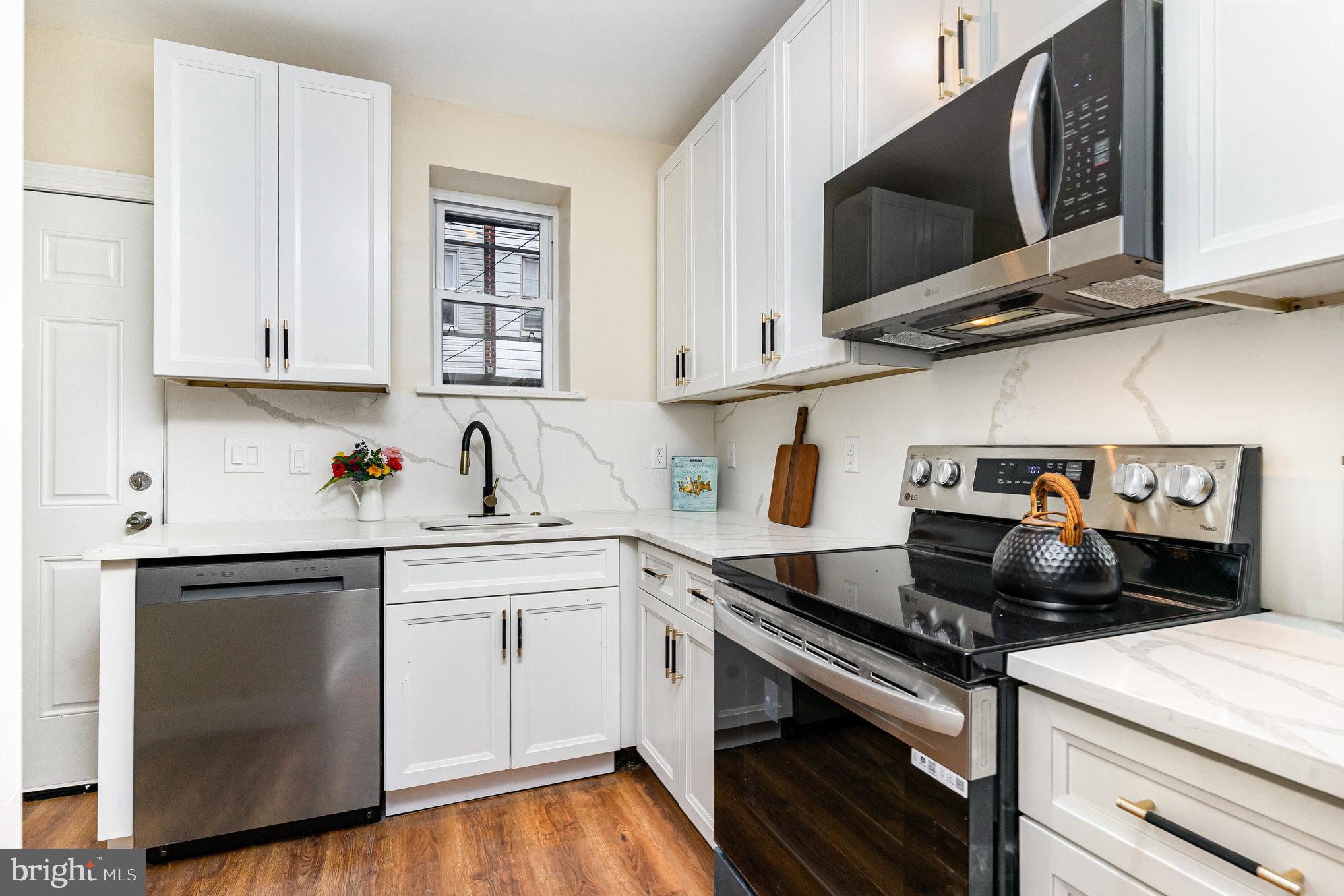 Welcome to this beautifully renovated home offering stylish finishes and thoughtful upgrades throughout. This modern residence has been completely rehabbed and features a brand-new HVAC system, new windows, new flooring, a new kitchen, and updated bathrooms—plus plenty of storage space.
The main level offers a bright and open living and dining area, complemented by a convenient powder room. The sleek kitchen is designed to impress with quartz stone backsplash, all-new stainless steel appliances, and direct access to a nicely sized backyard—perfect for relaxing or entertaining.
Upstairs, you’ll find three comfortable bedrooms and a beautifully updated full bathroom, all finished with clean, modern details. The fully finished lower level provides additional living space ideal for a family room, playroom, or home office. Additional highlights include central heating and cooling for year-round comfort and a brand-new roof, offering peace of mind for years to come. Located on a quiet block and close to public transportation and local businesses, this move-in-ready home is perfect as a first purchase or a turnkey rental opportunity to start building generational wealth. All that’s left is for you to make it your own.
