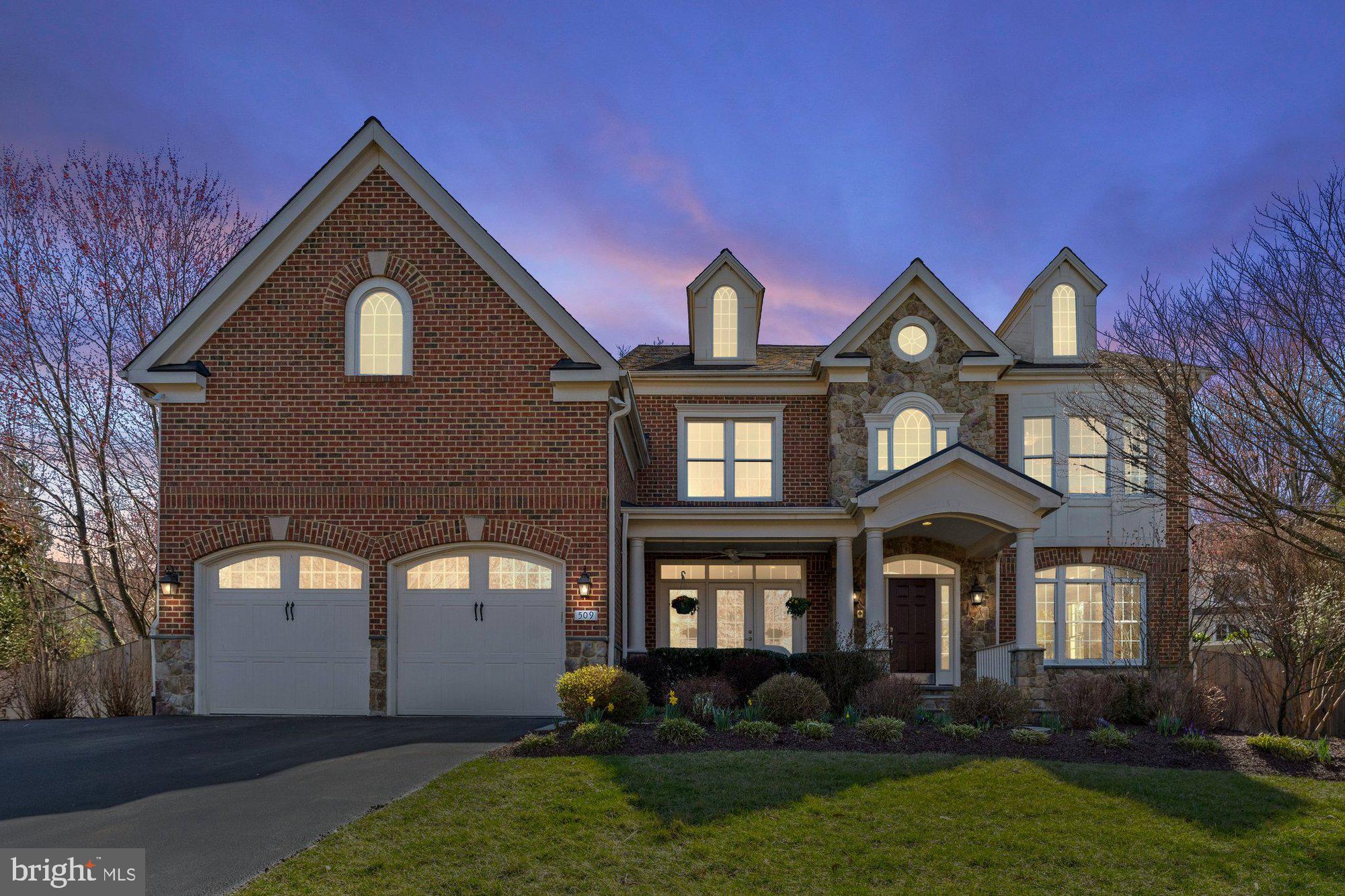 This stunning 6 bedroom, 5.5 bathroom home offers 7,930 square feet with an exceptional blend of luxury, functionality, and privacy. Thoughtfully designed with an open floor plan, the main level seamlessly connects the kitchen to the family room, creating a bright and inviting space for everyday living. Large windows fill the home with natural light throughout the day, while Silhouette window treatments add a touch of elegance. The gourmet chef's kitchen features custom cabinets, new quartz countertops, and backsplash. A mudroom with  washer and dryer helps keep messes contained, while a second refrigerator and oversized pantry allow for bulk shopping and entertaining. On the upper level you will find the primary suite which boasts an impressive his and hers walk-in closet system, providing direct access to both the bedroom and bathroom. Each additional bedroom features high-end custom closets, ensuring ample storage and organization. Upstairs you will also find an additional washer and dryer. The finished 4th floor multipurpose space with en suite bath can be used as an additional bedroom, playroom, au pair suite, or private office. The spacious finished basement offers separate areas for entertaining and exercise, a wet bar, generous finished and unfinished storage space, and a large bedroom with en suite bathroom. Sited on a 0.40 acre lot, this beautifully landscaped front and back yard features over $250,000 worth of improvements, provide privacy and include a high-end grill, a unique gas-to-wood log fire pit, and a relaxing water feature. Outdoor living is further enhanced by a welcoming front porch, an oversized two-car garage with extra storage, and a cul-de-sac location that serves as a great play area. Wolftrap/Kilmer/Madison Pyramid