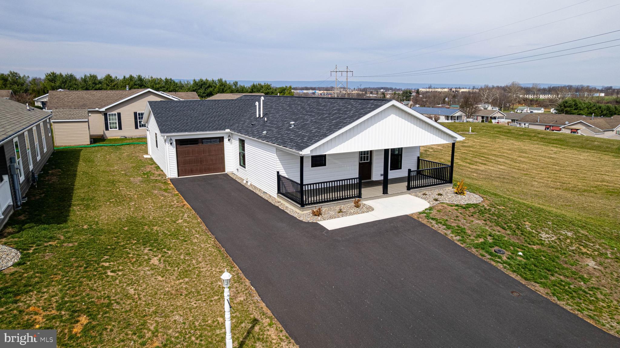 New 2025 home located in the 55+ community of Shippensburg Village. This move‑in ready home offers 1,680 sq. ft. of single‑level living with an open‑concept floor plan, 2 bedrooms, and 2 full baths. The layout provides generous living space with modern finishes and excellent natural light.

Features include a large covered porch with Trex decking and vinyl railing, an attached garage for convenient parking and storage, and low‑maintenance exterior materials. The home is located close to shopping, restaurants, medical services, and provides quick access to Interstate 81.

A newly built home in a well‑maintained 55+ community with convenient proximity to local amenities.
