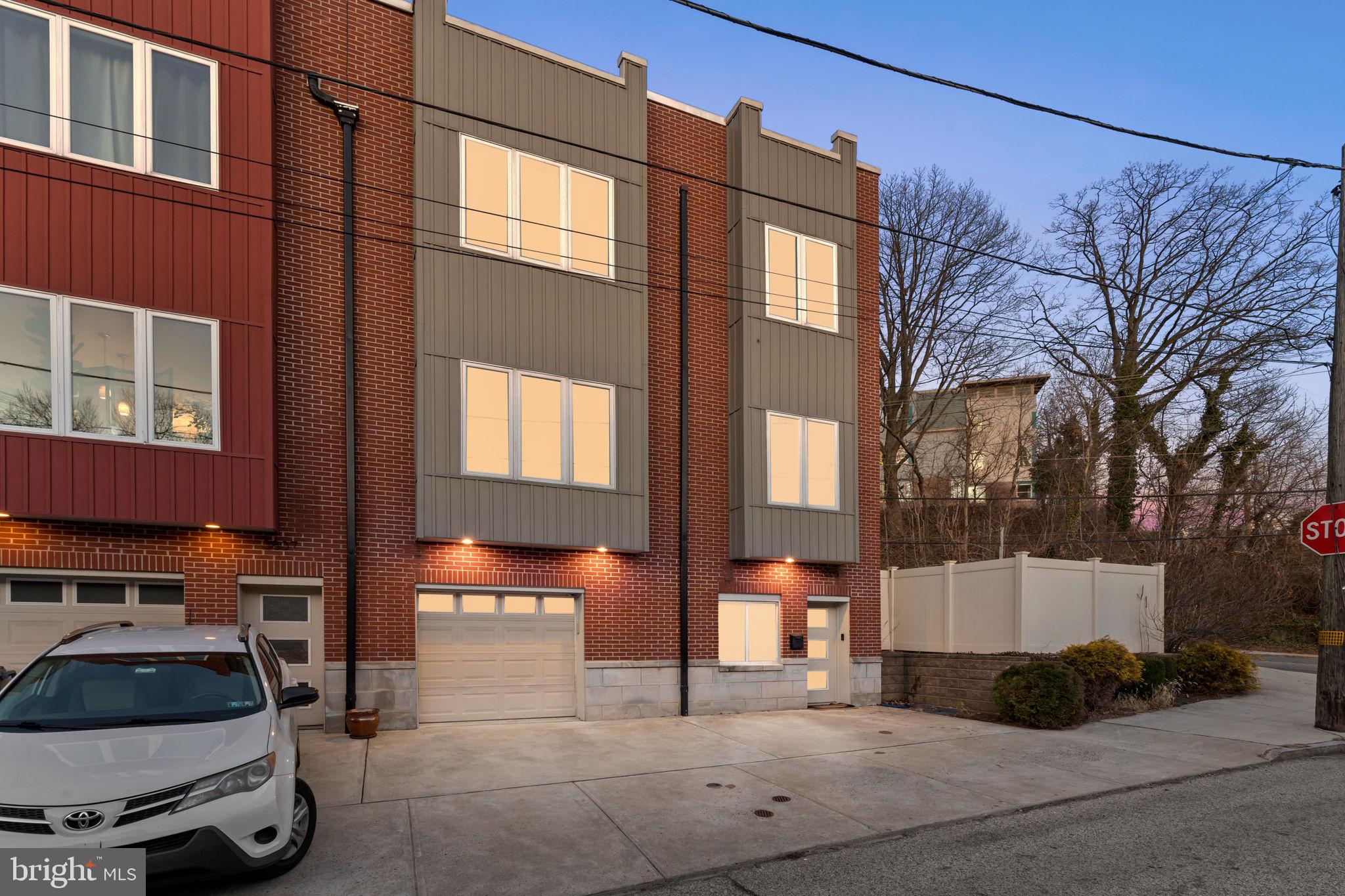 Stunning Manayunk Home with Roof Deck, Fenced Yard & 4-Car Parking!

Welcome to 3805 Lauriston St, a former model home offering an unbeatable Manayunk location with 2,052 sq. ft. of spacious living, 4-car parking (2-car garage + 2 driveway spots), and multiple outdoor spaces, including a fenced-in yard and a spectacular roof deck with breathtaking city views.
This 2-bedroom, 3 full-bath home was designed with luxury and functionality in mind. The open-concept main level features elegant wainscoting, full-wall built-ins, gleaming hardwood floors, and a modern chef’s kitchen with stainless steel appliances, granite countertops, and a large island—perfect for entertaining.

Upstairs, the primary suite boasts a spa-like en-suite bath, ample closet space, and large windows letting in tons of natural light. The second bedroom is equally spacious, with easy access to another full bath. The third full bathroom is conveniently located on the lower level, where you’ll also find additional living space, ideal for a home office, gym, or guest area.

Outdoor lovers will appreciate the fenced-in yard—perfect for pets, gardening, or relaxation—as well as the private roof deck offering stunning skyline views. Plus, you’re just steps from Wissahickon Trails, providing easy access to scenic walks, hikes, and biking trails.

Prime Manayunk Location

Restaurants & Bars Nearby: The Rook, CC Creamery, Dalessandro’s, The Goat’s Beard, and Taqueria Amor.

Parks & Playgrounds: Pretzel Park, Venice Island Park, and Gorgas Park.

Easy Access: Just minutes from Main Street Manayunk, Kelly Drive, and the regional rail for quick commutes to Center City.

With ample parking, modern finishes, and a prime Manayunk location, this home is a rare find. Don’t miss your chance—schedule your showing today!
