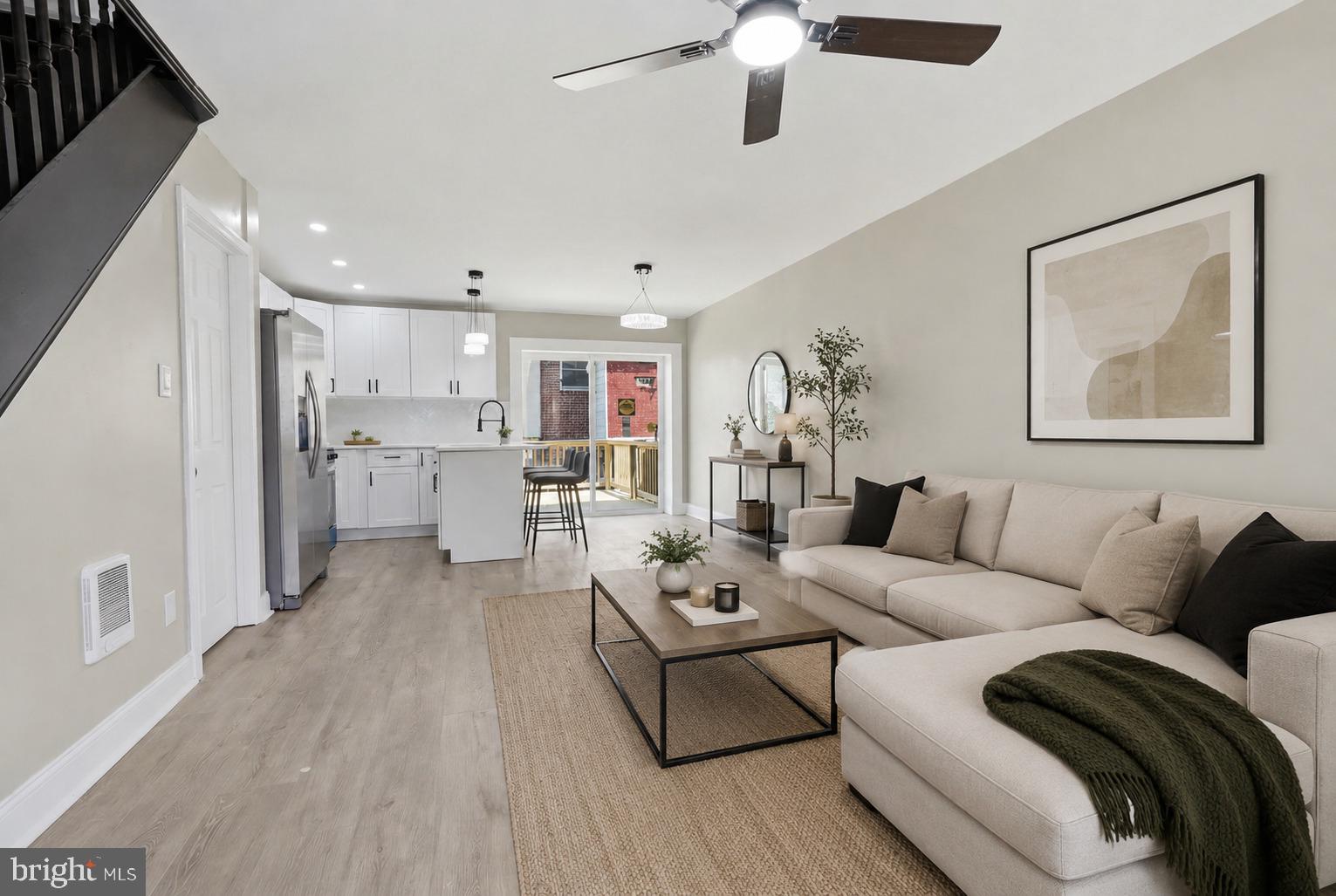 Completely renovated from top to bottom, this stunning 3-bedroom, 2 full bathroom home is move-in ready! Step inside to an open-concept main level featuring a beautifully designed kitchen with a spacious quartz island, abundant cabinetry, stainless steel appliances, and modern finishes throughout. The attention to detail is evident in every room, from the designer lighting and updated flooring to the stylishly renovated bathrooms. Upstairs you'll find generously sized bedrooms, while the finished lower level offers a third bedroom with its own full bathroom—perfect for guests, a home office, or additional living space. Enjoy seamless indoor-outdoor living through the rear double doors leading to a large private deck, ideal for entertaining, relaxing, or summer BBQs. Additional features include a welcoming front porch, private rear parking, recessed lighting, ample storage, and quality craftsmanship throughout. Conveniently located near shopping, dining, parks, schools, and major highways. Just unpack and move in!