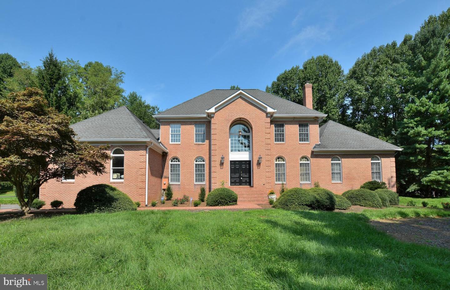 GREAT NEW PRICE!! Beautiful estate within minutes  to Great Falls Village and Great Falls Elementary.   Located on almost 3 lush acres, complete privacy is yours. Almost 6000 square feet this lovely home has plenty of room to raise a young family or entertain many guests for a long weekend. With a full size tennis court that can easily become a pickle ball court as well as a newly renovated, black bottom swimming pool, this home has all amenities a home owner can ask for.  Soaring ceilings and large windows bring in tons of light with embassy sized formal rooms for great entertaining.