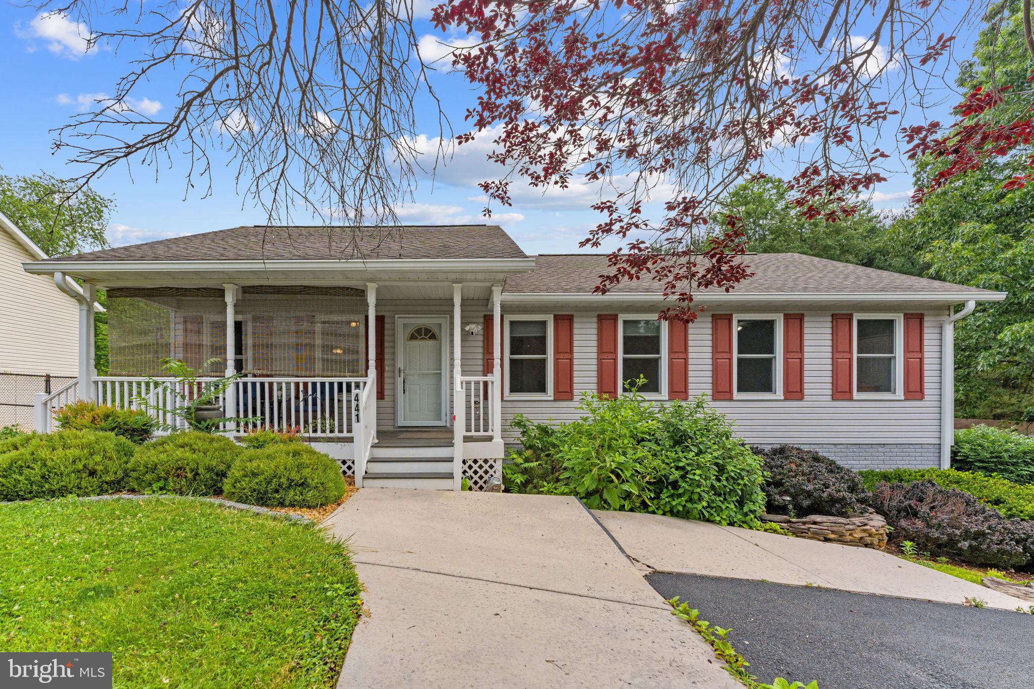 This 3-bedroom, 2-bath home is ideal for first-time buyers, downsizers, or anyone looking for low-maintenance comfort in a peaceful setting. Located on a quiet street with mature trees and beautiful landscaping, this home blends charm and practicality inside and out.

Step inside to find vaulted ceilings, durable laminate flooring, and ceiling fans throughout. The light-filled living area flows into an open eat-in kitchen featuring a center island, stainless steel appliances, and plenty of space for everyday meals or weekend entertaining.

The primary suite offers privacy and comfort with its own full bath, while two additional bedrooms provide flexibility for guests, a home office, or hobbies.

Outside, you'll love spending time on the welcoming Trex front porch, grilling on the back deck, fenced in yard or relaxing on the cozy side patio. The backyard is lush and open—perfect for gardening or simply enjoying nature—with mature trees adding beauty and shade.

Additional highlights include a rear-facing two-car garage, a Ring camera for security, generous storage space, a whole-home air filter, and reverse osmosis and brand-new water filtration system.

Thoughtfully maintained and move-in ready, 441 Palomino Place is a wonderful place to start your next chapter.