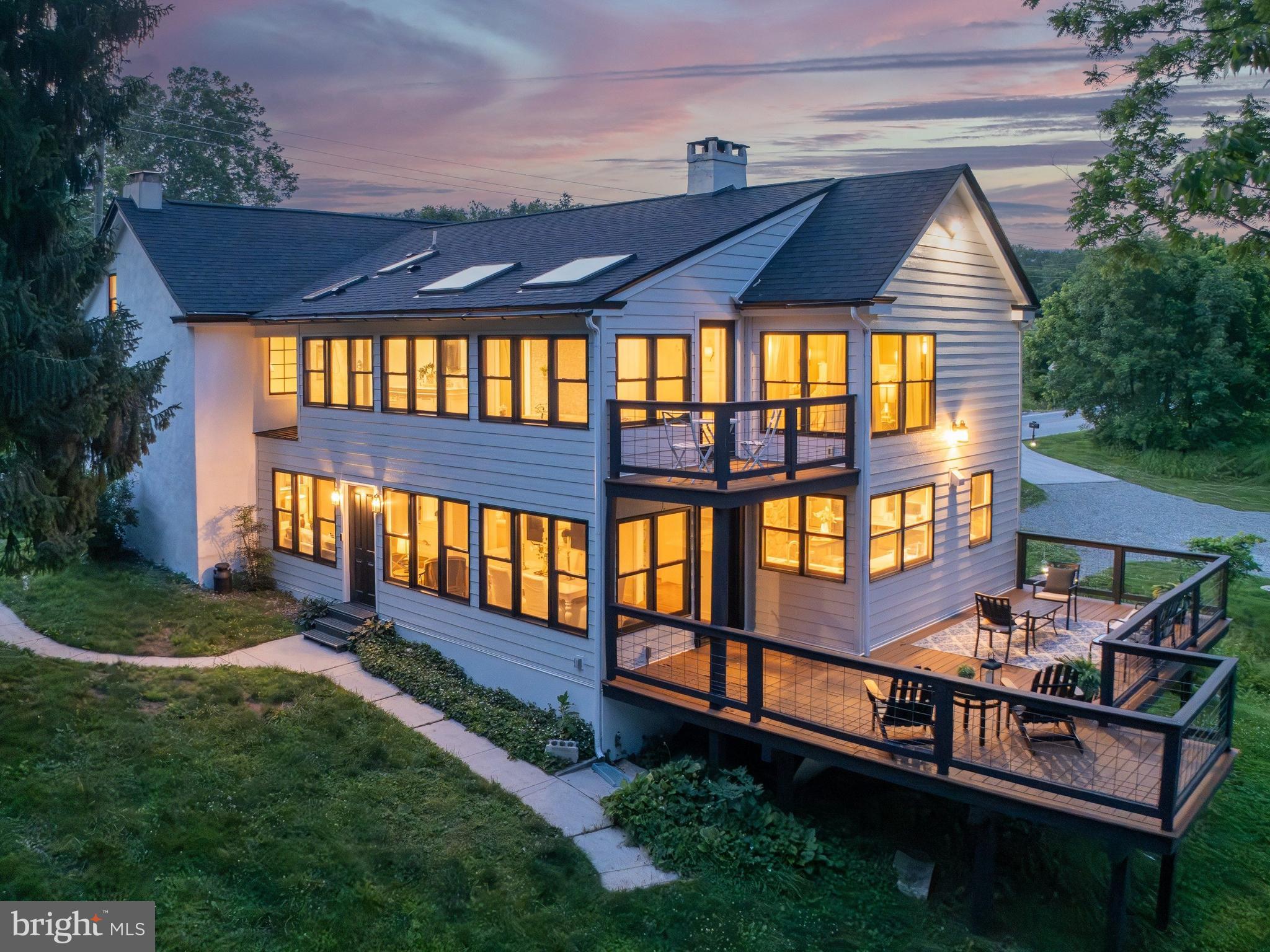 Open House Dates: Thursday, June 18th 4:00- 6:00 and Saturday, June 20th 12:00 - 2:00.   **Historic Elegance Meets Modern Luxury at 1510 State Road** Steeped in history & rich in character, this extraordinary circa-1792 residence seamlessly blends timeless Old World craftsmanship w/ thoughtfully curated modern updates. Nestled on 2.5 picturesque acres overlooking the protected beauty of Pickering Creek Preserve, 1510 State Road offers a rare opportunity to own a truly one-of-a-kind property where historic charm & contemporary comfort coexist in perfect harmony. From the moment you enter, you'll appreciate the remarkable architectural details that have been carefully preserved throughout the original home, including random-width hardwood flooring, period millwork, original built-ins, & multiple fireplaces that reflect the home's rich heritage. Freshly refinished hardwood floors & a newly painted interior provide a crisp, elegant backdrop for today's lifestyle. The Family Room is a stunning gathering space featuring beautiful wainscoting, a charming dry sink with original cabinetry, hardwood flooring, & featuring a fireplace tucked behind original built-in cabinetry. The  gourmet Kitchen is designed to impress, offering radiant-heated brick flooring, quartz countertops, custom cabinetry, updated stainless-steel appliances, & a professional six-burner range. Adjacent to the Kitchen, a sun-filled Sunroom with flagstone flooring opens to a spacious deck overlooking the surrounding preserve, creating an idyllic setting for year-round entertaining &  relaxation. The inviting front Living Room showcases rich hardwood flooring, a dramatic stone fireplace with propane stove insert. A cozy Office or Den provides the perfect space for working from home or quiet reflection. Adding to the home's historic appeal are two original staircases, including a beautifully preserved curved staircase that serves as a striking architectural focal point. The second level features a luxurious Primary Suite complete with hand-scraped cherry flooring, exposed beam ceilings, custom wardrobe cabinetry, & a spa-inspired bath featuring radiant-heated floors, a jetted Kohler soaking tub, & a dual-head shower. An adjoining room currently serves as an intimate sitting room but can easily function as a nursery, bedroom, or private retreat. Two additional bedrooms and two full baths complete the second floor. The third level offers a charming fifth bedroom with beautifully restored original hardwood flooring and a convenient half bath, while a walk-up attic also on the third level provides storage space. Significant updates include replacement windows throughout much of the home, refinished hardwood flooring, fresh interior paint, and numerous enhancements inside and out, that ensure the property is move-in ready while preserving its historic integrity. Outside, enjoy breathtaking panoramic views of the surrounding Pickering Creek Preserve, mature trees, and private wooded areas that create a peaceful sanctuary unlike any other. Despite its tranquil setting, the property is conveniently located near major roadways, shopping, dining, and everyday conveniences and is part of a vibrant community that offers access to parks, walking trails, making it perfect for those seeking an active lifestyle. Located just 13 mins to the Paoli Train which will take you north to D.C. & East to Phila & then straight to NYC. Just 10 min. to downtown Phoenixville (voted #1 Best Small Town to live in America by Travel + Leisure magazine /2025). Located 7 minutes to  the Phoenixville Country Club, 2 mins to the Phoenixville YMCA, hiking trails, Valley Forge National Park is 3 miles away, & KOP Mall 7 miles. This property is a  rare offering that beautifully marries nearly two and a half centuries of history with modern luxury, 1510 State Road is more than a home—it's a legacy property waiting to be cherished by its next steward. (*Pool area is AI generated - there is no pool).