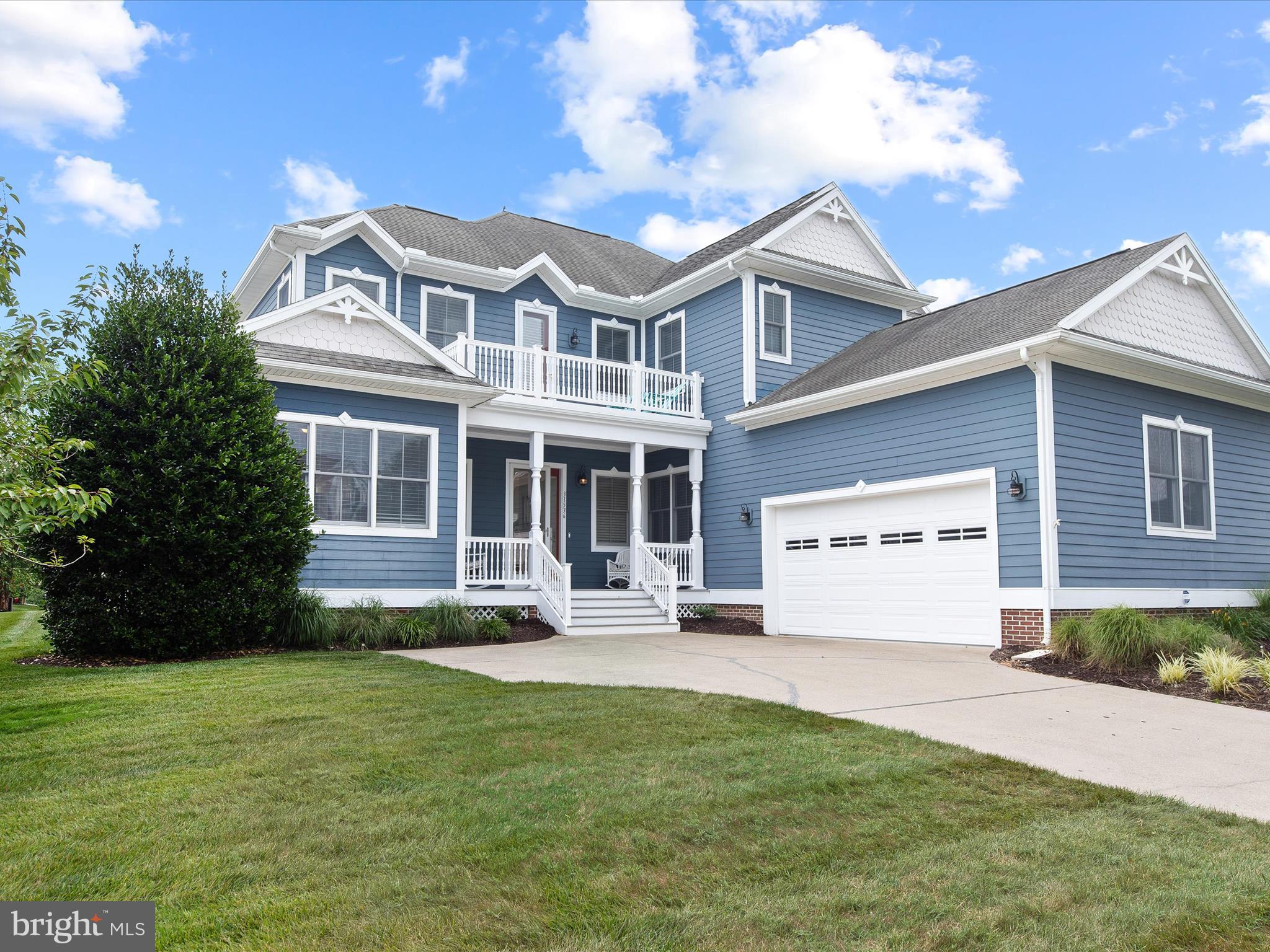 Discover this stunning turn-key coastal-style home, beautifully furnished and situated in the highly sought-after Bayside Fenwick community, renowned for its premier Jack Nicklaus golf course and extensive amenities. A great investment property with just over 85K of rental income in 2023!  A welcoming covered front entry invites you into a meticulously maintained residence showcasing impressive architectural features such as soaring ceilings, crown moldings, beautiful hardwood floors, custom built-in shelving, and spacious interiors.  Designed for resort-style living and grand-scale entertaining, the open two-story great room features multiple gathering areas illuminated by natural light from numerous stacked and picture windows, and ample recessed lighting. A traditional gas fireplace, framed by an arched bookcase and passage entry to the owner’s suite, adds a cozy touch.
The gourmet kitchen boasts 42” display cabinetry, sleek dark granite countertops, stainless steel appliances, pendant lighting, and ceramic tile flooring that perfectly complements the kitchen’s color scheme. Enjoy meals at the extended peninsula breakfast bar, in the adjacent dining area, or on the screened porch overlooking the manicured grounds and brick paver patio – an ideal spot for family and friends to gather.  The tranquil primary bedroom offers a sitting area, a spacious walk-in closet with custom shelving, and a luxurious ensuite featuring dual vanities, a soaking tub, a glass-enclosed stall shower with a bench, and a private water closet. Another bedroom with an ensuite is conveniently located off the foyer, perfect for guests who need main-floor amenities. The main level also includes a third bedroom, a full bath, a large laundry room with custom cabinetry, and access to the oversized garage.
Ascend the staircase to find a spacious loft and additional sleeping quarters. The loft provides an ideal space for family movie nights, games, or stargazing from the adjacent balcony. Three generously sized bedrooms are located on this level, one with an ensuite, and two others sharing a full bath at the opposite end of the loft.  There is an outside shower to rinse off after a fun day at the beach.  The exterior was repainted (2018-2019), there is an encapsulated crawl space with a sump pump and dehumidifier, newer appliances, a rear yard French drain system, and Hunter Douglas shades throughout.  Bayside is located on Assawoman Bay, less than 4 miles from Fenwick Island and Ocean City. The quarterly HOA fee covers lawn care, shrub and tree maintenance, mulching, weeding, power washing, trash and recycling, snow removal, and irrigation. Sports Membership includes all amenities, with golf memberships available for purchase. This spectacular home is being sold furnished and won’t last long! Whether you're looking for a forever home, a beach retreat or an investment property, 31536 Winterberry Pkwy could be the perfect home for you.
