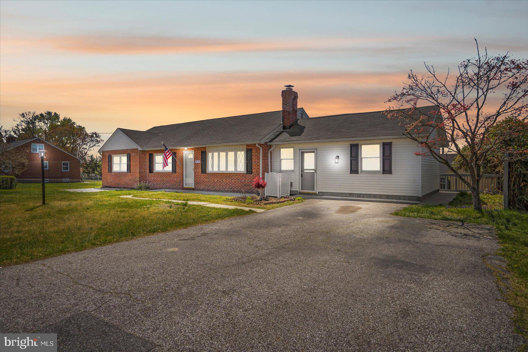 Newly remodeled 4BR/2BA expanded rancher with a detached two-car garage located on a sprawling corner lot in Perry Hall! Ample parking is available in the front driveway and is within steps from the door into your new home.  Open the door and step into the main living space featuring the open floor plan homeowners are seeking.  Notice the abundance of natural light, the luxury flooring, new carpeting, and elegant lighting fixtures. The main living space consists of a large living room, a spacious breakfast nook with an accent wall, and a beautiful kitchen.  The kitchen features mixed metals with gold hardware and stainless steel appliances, plenty of cabinets, sleek quartz countertops, a tiled backsplash, a stainless sink under a window, and a large island with breakfast seating for three.  Just beyond the breakfast nook is a spacious dining room, and the first of three bedrooms on the main floor, all with new carpeting.  Tucked behind the kitchen is a large enclosed sunroom with three walls of windows overlooking the yard.  On the opposite side of the home is a sizable secondary bedroom, a grand primary bedroom with two closets, and a stunningly designed full bath with a double sink vanity and a beautifully tiled walk-in shower featuring a built-in bench and a rainfall ceiling shower head. On the lower level is the fourth bedroom, a large family room, a home office or craft room, a full bath with tile from ceiling to tub, a laundry room with folding area and cabinets, and storage.  From the main floor step outside to a large tiered wood deck that overlooks a fenced yard filled with green space, access to the two-car garage and additional driveway parking, a shed, and so many possibilities.  This home is move-in ready with so much to offer new homeowners and is in prime location in close proximity to Honeygo Regional Park and Community Center, I-95, 695, and tons of shopping and dining options in Perry Hall and White Marsh.