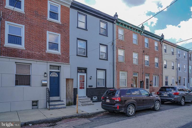 COVID 19 showing alert. Listing agent will sanitize and open door if  buyer wants to take a tour of this property .This adorable  home boasts 3 bedrooms and  1.5 Bathroom is tucked away on a quiet street in Port Richmond but close to all the major roads. Hardwood woods floors throughout the home, updated kitchen and bathroom as well. Parking is a huge bonus with rear yard entrance to your home.  Check out i95revive for future green space under the old I95 and along Richmond St behind the house.