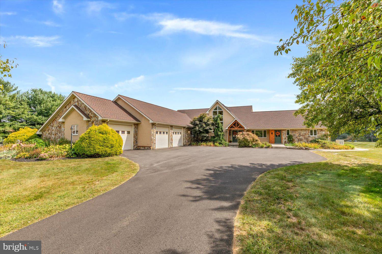 Welcome to 4 Hawkfield Road. This one-of-a-kind, sprawling rancher is a 4,542 sq ft Stanley Bauman custom build. Drive through the driveway columns and into an expansive 3.3 acre estate. The newly resealed driveway is lined with trees and leads to a 2024 built 6-bay, climate controlled garage and a 2-bay pole barn garage. The fenced-in backyard boasts a heated pool surrounded by natural stone and a 2-year old grand pavilion with a built-in kitchen. The home features a first floor in-law suite with amazing accessibility features including a separate entryway ramp, roll-in shower, and wide hallways. The stone fireplace and hardwood flooring in the living room lead into the kitchen which has stool seating, an oversized countertop, and built-in appliances. With 2 sunrooms, one of which has a vaulted wood ceilings and a hot tub, there is a seamless transition between indoor and outdoor living. The first floor laundry room and attached 3-car garage provide convenience and simplicity for modern living. The large 2nd floor primary bedroom has an attached outdoor deck for additional outdoor living. Complete with an elevator and meticulously maintained landscaping, this home is set apart from any other. This is the perfect forever home to grow old in and has stunning garage facilities for a car lover. Located close to I-476 and I-78, this estate is only 1.5 hours from Philly and 2.5 hours from New York. The home is an ideal place to relax and enjoy the peaceful surrounding countryside with a private setting. Taxes may be decreased by about $4700 annually with appeal.
