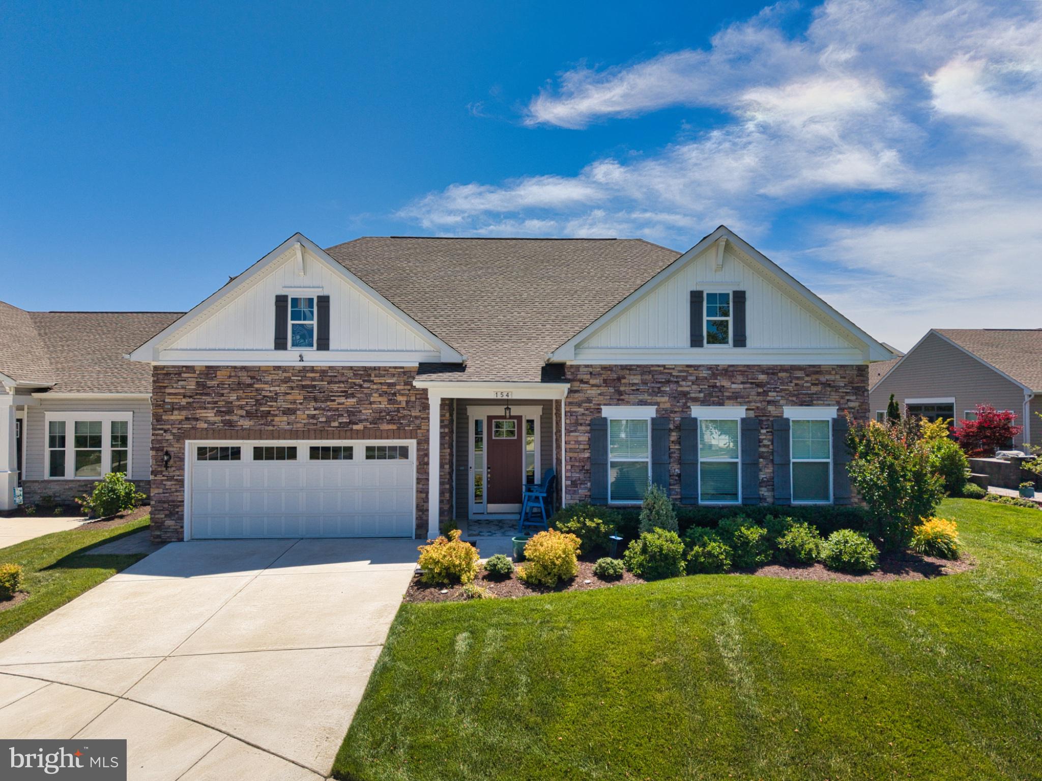Welcome to luxury, comfort, and effortless living in the highly sought-after first section of Four Seasons at Kent Island. Offering a floor plan no longer available in the community's newer sections, this exceptional home combines thoughtful design with upscale finishes throughout. A spacious foyer welcomes you into an open and inviting layout that is perfect for both everyday living and entertaining. At the heart of the home is a stunning gourmet kitchen featuring an oversized center island that naturally becomes the gathering place for family and friends. Whether hosting indoors or enjoying the outdoors, you'll appreciate the seamless flow to the screened porch and beautifully designed patio complete with a built-in fire pit. The private primary suite is a true retreat, highlighted by an elegant tray ceiling, an impressive custom walk-in closet system, and a luxurious en-suite bath featuring a spacious walk-in shower, dual vanities, and a dedicated built-in makeup vanity. The main level also offers a second bedroom, full bath, private home office, and convenient laundry room, providing the ease of one-level living. Upstairs, guests will enjoy their own private space with an additional living area, bedroom, and full bath and access to the conditioned sky garage which is great for storage. Attached two car garage with epoxy flooring and inside access. Beyond the home, enjoy the award-winning lifestyle Four Seasons at Kent Island is known for. Residents have access to an impressive 24,000-square-foot clubhouse featuring indoor and outdoor pools, a state-of-the-art fitness center, tennis and pickleball courts, dog parks, walking trails, and an active calendar of social events—all designed for exceptional 55+ living.