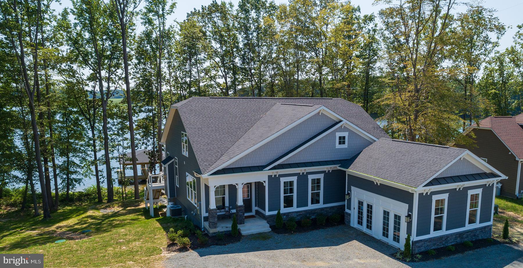 Ready Early Fall 2023!! -Gorgeous Waterfront Lot (37)! Offering the to-be-built Banyan ll Model in Lake Anna's newest subdivision, Rock Island, located on the private side of Lake Anna.  The lot offers 250 feet of waterfront living with stunning open views of the lake! The main level boasts a primary suite, tile shower, and walk-in closet. The open floor plan includes a Deluxe Kitchen with white cabinets and upgraded appliances, a living area with a stone fireplace perfect for those cold winter lake nights, and a dining area all covered by vaulted ceilings. Take the craftsman stairs to the upper level that has a loft overlooking the main level as well as two bedrooms and two full bathrooms. The lower level features a fully finished basement w/ walk out patio. The basement layout features a media room, rec room, 4th bedroom, and rough-in for plumbing on an additional bathroom. The two-car attached side load garage offers room for all of your lake toys! Builder contract is required. 7.5% down Evergreene Homes offers turn-key worry-free financing with 10-year warranty. Photos are of the same model at a different location.

OFF-SITE MODEL HOME OPEN SAT AND SUN 
 80 FAIRVIEW DR MINERAL, VA 23117 12-3PM

Close to Food Lion, Lake Anna Taphouse, Vitos at Lake Anna and much more!