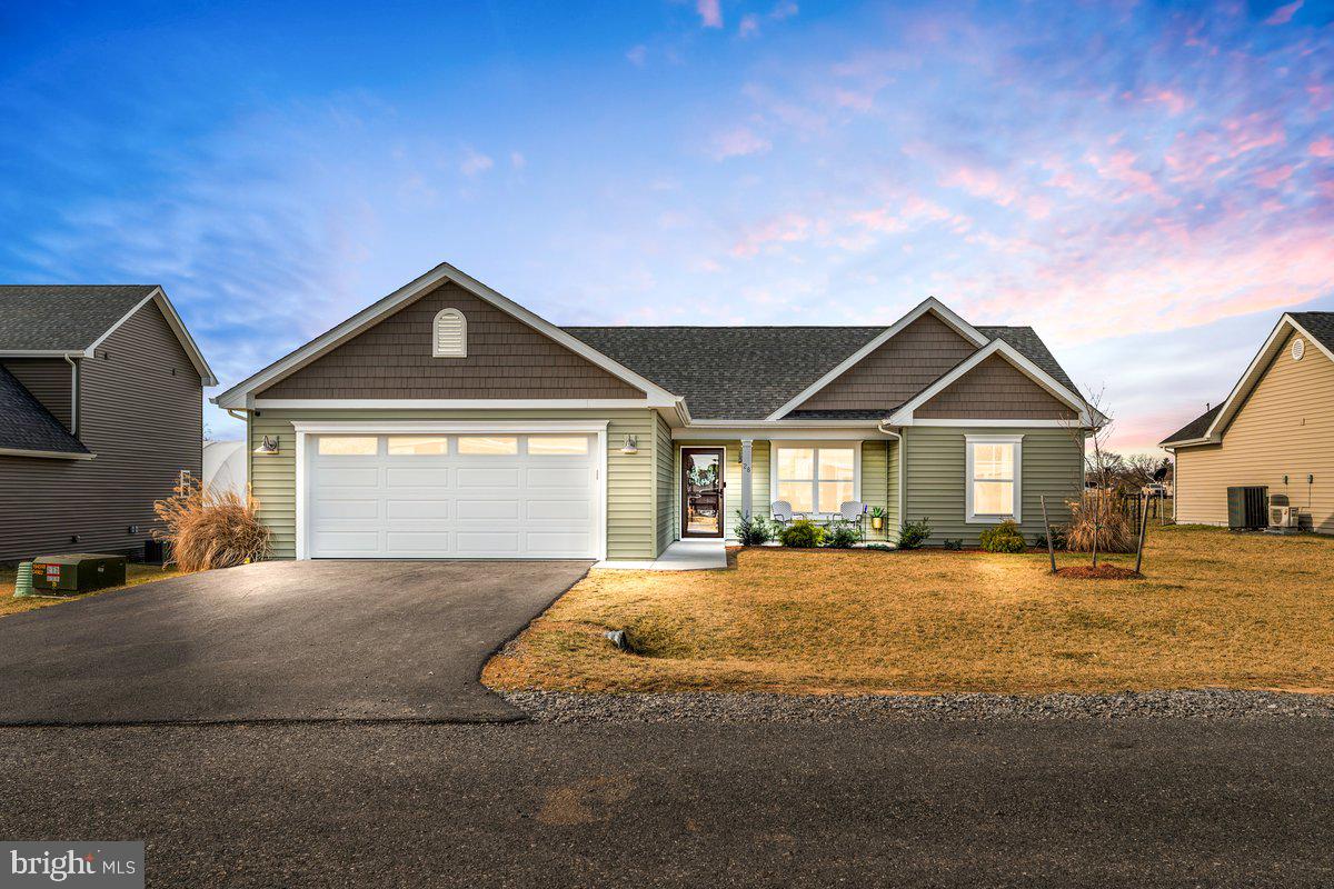 Built in 2023, this nearly new home in Harvest Glen offers stylish, low-maintenance living in a tucked-away yet convenient location. Thoughtful finishes include LVP flooring, a ceramic tile backsplash, and quartz countertops. The open, one-level layout features wide doorways, a custom-tiled walk-in shower with a glass door in the owner’s suite, and covered front and rear porches. Enjoy a fenced backyard and modern comfort in this move-in-ready home!