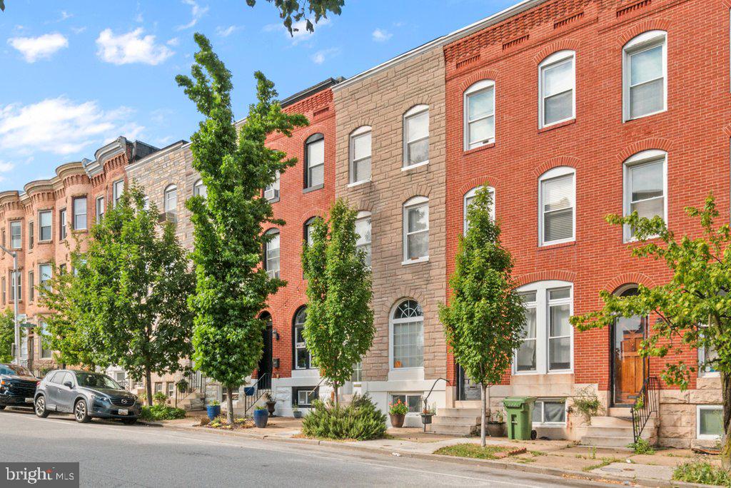 Historic character, modern comfort, and a true Reservoir Hill address come together at 2223 Madison Avenue—a classic Baltimore rowhome tucked into one of the city’s most architecturally rich, park‑adjacent neighborhoods.

Step inside the marble‑stoop entry and charming vestibule to find original wood floors, detailed wood trim around the windows, built‑in wall sconces, and French doors that showcase the home’s old‑world character. The main level offers a separate dining room perfect for gatherings, an updated kitchen with abundant real‑wood cabinetry and modern stainless steel appliances, and easy flow out to a fully fenced rear patio with garden space—your own quiet outdoor retreat in the city.

Upstairs, three comfortable bedrooms on the second level provide flexible space for guests, office, or hobbies. The entire third floor is dedicated to a private primary suite, featuring a generous bedroom and large bath on its own level—creating a true “retreat” feel rarely found in city homes. An unfinished basement adds plenty of storage and future potential.

Set in historic Reservoir Hill, this home is surrounded by tree‑lined streets, grand Victorian‑era architecture, and a strong sense of community just south of Druid Hill Park—one of Baltimore’s largest green spaces with trails, the Maryland Zoo, courts, and more. Residents enjoy walkable access to community gardens, Whitelock Community Farm, neighborhood cafes, and convenient transit to downtown, Penn Station, and city hotspots. With quintessential Baltimore charm and a coveted location in a revitalized historic neighborhood known for its architectural diversity and tight‑knit vibe, 2223 Madison Avenue is a special opportunity to own a piece of Reservoir Hill’s story. HOME IS BEING SOLD AS-IS.