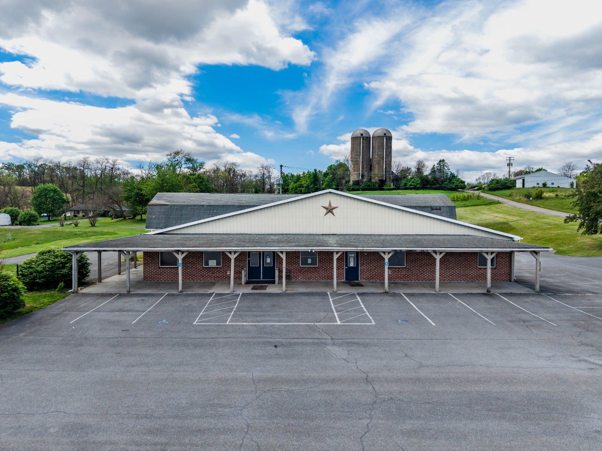 Located on Holly Pike, this property is an easy 15 minute drive from major retailers and PA Turnpike. This site is located on a heavily traveled road and offers excellent visibility with 2 entrance and exits onto Holly Pike.
 A premier commercial opportunity on a generous 13 acre lot. This versatile property features an expansive 11,000+ square foot main building, formerly the home of the Carlisle Country Market and also a leased single family home on the back of the property