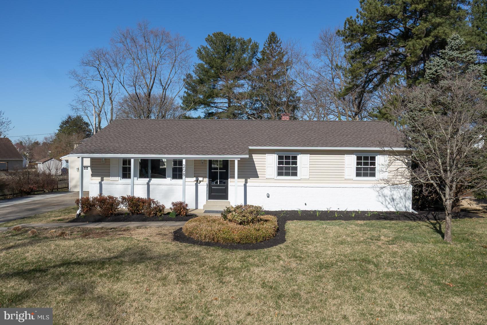 Set on a nearly 1/2-acre lot in the tranquil community of York Manor, this fully renovated ranch-style home in Timonium offers modern living with thoughtful details throughout! A sprawling front lawn complements the brick accents and clean lines of this single-story abode. Inside, refinished original hardwood floors, recessed lighting, and neutral tones create an inviting atmosphere. The open-concept layout seamlessly connects the main gathering areas with a kitchen designed for both function and flair. Abundant cabinetry, a 5-burner stove with a pot filler, a striking tile backsplash, and sleek countertops extend to an oversized island, perfect for meal prep and casual dining. Your primary suite is a comfortable retreat with a spa-inspired ensuite featuring a frameless shower. Three additional bedrooms and two updated baths offer versatility for any lifestyle. A finished basement is ideal for use as a media room, gym, or recreational hub. Venture outside to a sunlit deck overlooking the backyard, while a separate covered patio with an outdoor fireplace makes entertaining effortless. A long driveway leads to a detached 2-car garage, ensuring ample parking. Located near shopping, dining, and I-83, you’ll also have easy access to downtown Baltimore. Come seize the opportunity to experience it today!