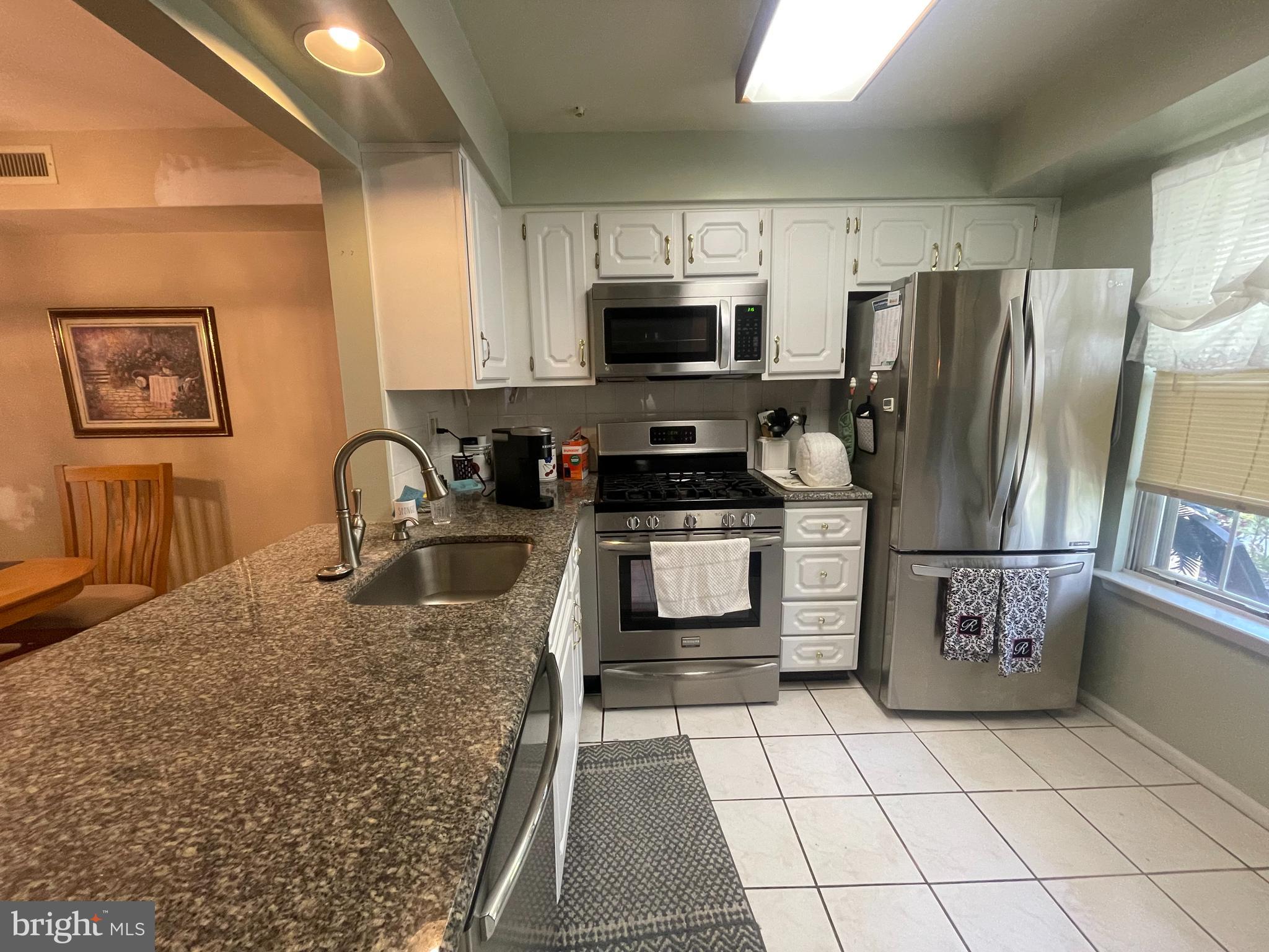 Rarely offered 1st floor corner end condo in Newtown Grant Development ! 2 Bedroom , 2 full bathrooms 
 BACK ON THE MARKET !!!!!Buyers financing fell through .Heres another opportunity - multiple offers last go around - dont wait ! Make  your appointment today !

 Welcome to 3203 Society Place . Front covered patio ,  foyer with ceramic tiled entry area , coat closet . Modern kitchen with stainless steel appliances including Frigidaire dishwasher , Frigidaire gas range/ oven , built in microwave, LG stainless steel  fridge , granite counter tops , tiled back splash , ceramic tiled flooring. Stool seating area . Dining area with carpets and chandelier. Living room area with carpets , exit to side patio facing woods , storage closet . Hall coat closet , utility closet with washer / dryer , gas forced hot air heat and central air , gas hot water heater , circuit breaker box . Modern hall bathroom with ceramic tiled floors and tub / shower walls . Granite sink cabinet, vanity , toilet . Bedroom 1 with carpets , double closet . Primary bedroom with carpets , walk in closet with built in shelving  , modern primary bathroom with ceramic tiled flooring, large granite sink cabinet, tiled walls with stall shower . . Desirable Council Rock School District  , close to all the shopping and restaurant district  in Newtown   ! Community pool , playground area ,tennis and basketball courts , walking paths, Tyler state park,  l lot , large parking lot .
