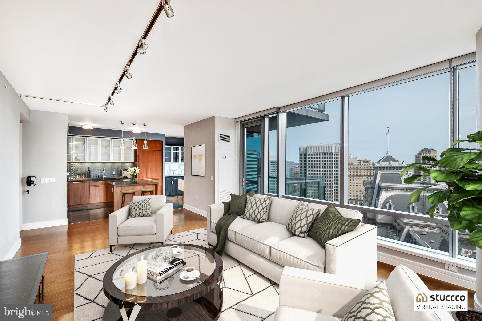 One of the most sought after floor plans  in The Ritz-Carlton Residences, and the only layout with a private balcony overlooking iconic City Hall with its clock tower, and Dilworth Park.  This 3-bedroom, 3 and a half bath beautiful home features wood floors in living areas, floor-to-ceiling operable windows, custom lighting, solar shades, custom built-ins and closets. 
One PARKING LICENSE included, in the on-site garage with 24-valet service.
The best of luxury living with access to world-class Ritz-Carlton services and resident-only amenities. These include 24-hour concierge, porter, and valet services; chauffeur service; a state-of-the-art fitness center; an indoor lap pool, hot tub, and locker rooms with showers; and a private yoga room. The resident lounge is perfect for daily use or private events at no additional cost. Additional amenities include a theater room, a newly renovated outdoor terrace with grills, dining areas, fire pits, and lounge seating, an on-site dog park, and a gated garden.  A home that combines spacious living, exceptional amenities, and breathtaking views—all in the heart of Philadelphia.