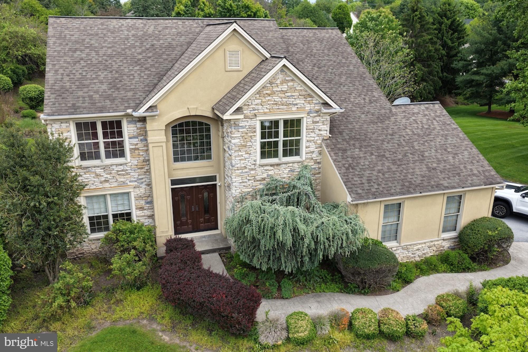 Welcome home to Stoney Run, one of Hummelstown’s most loved neighborhoods, known for its handsome homes, mature surroundings, and tucked-away, private-oasis feel. Set on a generous .55-acre corner lot in desirable Derry Township, this home offers the space, setting, and flexibility that are getting harder to find — more greenery, more privacy, and more room to run, play, garden, entertain, or simply enjoy.
Step inside to a bright, open layout designed for real life: entertaining, hosting, working, relaxing, and giving everyone room to spread out. The main level features warm flooring, detailed trim work, arched openings, a grand vaulted entryway, and an elegant spiral staircase that gives the home a memorable first impression. The living spaces feel spacious and welcoming, with a fireplace adding just the right amount of cozy.
The kitchen is a standout, built for both function and gathering, with granite countertops, gas cooking, double wall ovens, abundant cabinetry, a center island, and plenty of prep space. The bright breakfast nook, surrounded by windows and finished with vaulted ceilings, is the perfect everyday spot for coffee, quick meals, homework, or lingering a little longer in the morning. Translation: weekday dinners, holiday cooking, snack spreads, you name it — this kitchen can handle it.
Upstairs, you’ll find four spacious bedrooms, including a primary suite that feels like a true retreat with a tray ceiling, generous layout, ample closet space, and a private bath featuring a soaking tub, separate shower, and glass-block window. Three of the bedrooms include walk-in closets, giving the home excellent storage and day-to-day functionality.
The finished lower level adds serious bonus space with a large recreation area, built-in wet bar/cabinetry, bathroom, cedar closet, game room potential, and extra storage — perfect for entertaining, movie nights, hobbies, guests, or simply creating a second hangout space.
Out back, the screened porch may quickly become the favorite spot in the house, overlooking the fully fenced yard, patio area, mature greenery, and plenty of open lawn. Morning coffee, evening unwinding, summer dinners, sounds of running & playing, quiet weekends — this yard gives you options.
With timeless architectural details, flexible indoor and outdoor living spaces, first-floor laundry, a finished lower level, a large private lot, and a sought-after Stoney Run location just minutes from Hershey Medical Center, downtown Hershey, trails, parks, shopping, dining, and major routes, this one checks the boxes that actually matter. *MULTIPLE OFFERS RECEIVED*