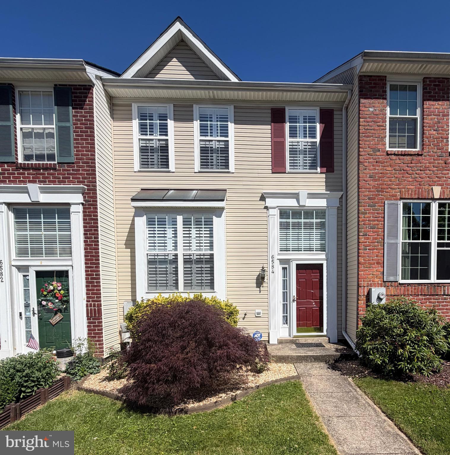 Welcome to 6584 Duncan Place, Frederick MD—a beautifully updated townhome built by Ausherman Homes, one of Frederick’s most trusted and reputable builders, known for solid construction, thoughtful design, and long-lasting value. That quality foundation shows in every room, and it’s been elevated even further with a long list of recent improvements.
This home has been refreshed throughout, giving it a clean, modern feel, that is move-in ready. You’ll find brand-new luxury vinyl plank flooring on all three finished levels, fresh paint throughout, new lighting, and new ceiling fans. Plantation shutters add a custom, upscale touch and give each room a polished, finished look.
The kitchen has been updated with new granite countertops and offers a comfortable, open layout that flows easily into the main living and dining areas. From the kitchen, step directly out to the brand-new Trex covered deck—perfect for relaxing or entertaining. A gas hookup for your grill or outdoor fireplace makes outdoor living simple and convenient, all while enjoying peaceful views of mature trees, open space, and nearby walking trails.
Upstairs, the bedroom level features well-sized rooms and bathrooms that have been updated with new granite countertops, tying the home together with a consistent and cohesive style.
The finished walkout lower level adds even more flexible living space with a wet bar,  bright, open feel and sliding glass doors that lead directly to the backyard and open space beyond. It’s ideal for a family room, home office, gym, playroom, or guest suite—whatever fits your lifestyle.
Major system upgrades give added peace of mind, including a brand-new HVAC system with gas backup heat and a brand-new water heater.
Located in a highly convenient Frederick location, you’re just minutes from shopping, dining, parks, walking trails, and commuter routes—making everyday life easy and accessible.
This home, may be the ONE!