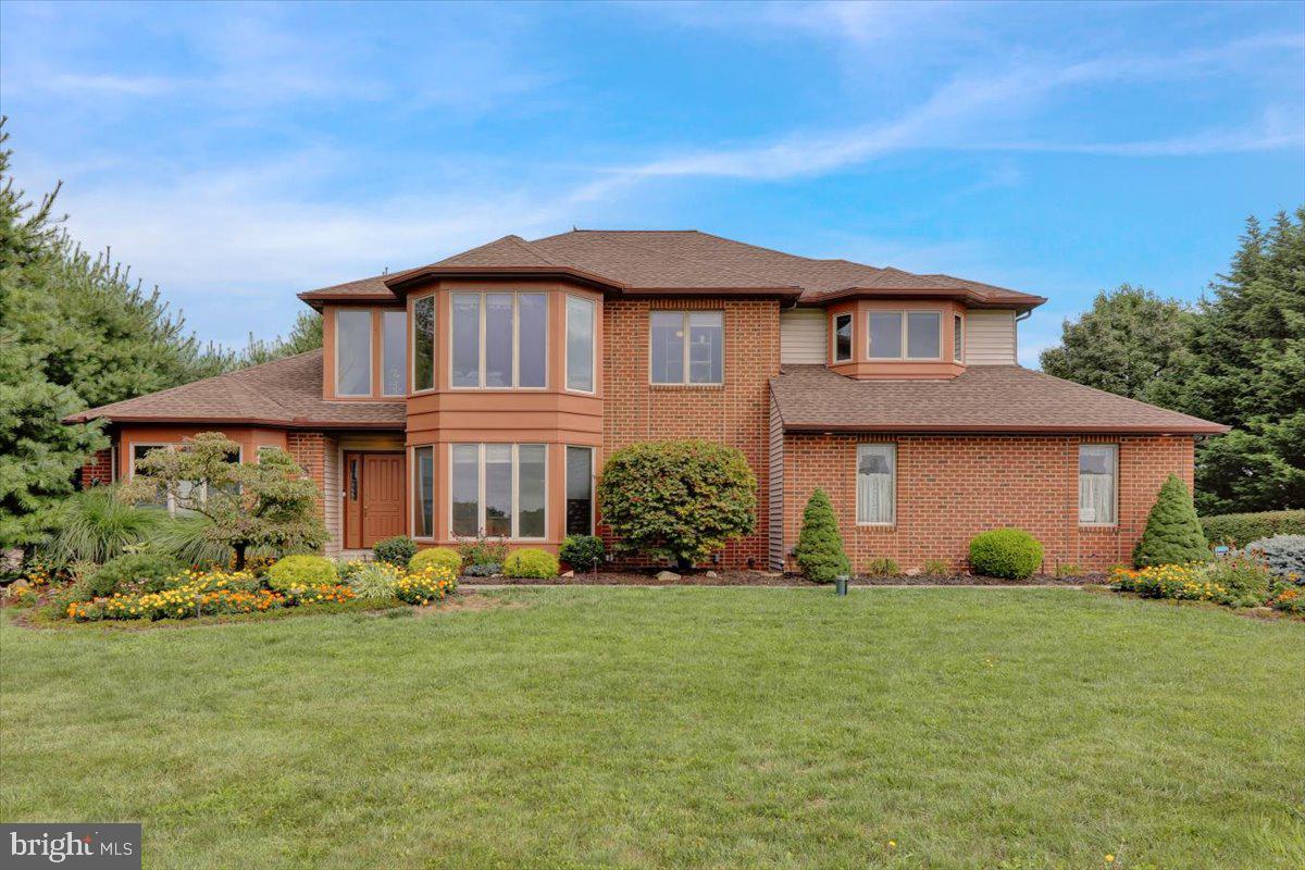 Welcome to 1230 Church Lane Road – a stunning, custom-built 5-bedroom, 3.5-bath home that blends unique architecture with warmth and functionality. From the moment you step inside, you're greeted by soaring ceilings, natural wood tones, and beautiful hardwood floors illuminated by dual chandeliers. To your right, a bright office/study with large windows and French doors provides a quiet retreat for work or relaxation.  On your left, the great room invites you in with its stunning hardwood floors and impressive, sky-high ceilings, creating a space both grand and inviting. The kitchen is a chef’s delight, featuring custom tiled flooring, Corian countertops, natural wood cabinetry, recessed lighting, and a third elegant chandelier. A breakfast nook with a built-in desk seamlessly opens into the inviting family room, where a gas-powered brick fireplace creates a cozy focal point. The raised-ceiling dining room, accessible from the kitchen, offers the perfect setting for gatherings. A convenient first-floor laundry/mudroom and half bath complete the main level. Designed for everyday living, the home boasts a large exterior deck, accessible from the kitchen’s sliding glass doors. Adjacent to the family room, a charming three-season sunroom offers a peaceful escape—ideal for plants or quiet moments. Large windows throughout flood the home with natural light, while dimmable lighting lets you set the perfect mood. The oversized two-car garage includes extra storage and connects into the laundry/mudroom for convenience. Ascending the winding staircase, the second floor offers four spacious bedrooms and two full baths. The luxurious master suite is the centerpiece, boasting an expansive bedroom, two walk-in closets, and a spa-like private bathroom with custom tile, dual vanities, a walk-in shower, and a jacuzzi tub. The finished daylight basement adds even more versatility, featuring an additional bedroom, full bath, and an open carpeted/tiled area—perfect as a playroom, entertainment space, or home gym—along with ample storage. This home is designed for family living, with large front and back yards, a spacious driveway, and a natural pine tree border for privacy. The open-concept layout fosters connection, while the upper-level bedrooms offer peace and seclusion. Ideally located in the highly sought-after Exeter Township School District, this home sits atop scenic Church Lane Road, directly across from a breathtaking 46-acre nature sanctuary. Enjoy the perfect balance of privacy and convenience—just minutes from major routes (422 & 222), shopping, and dining. Don’t miss the opportunity to make this one-of-a-kind home yours!