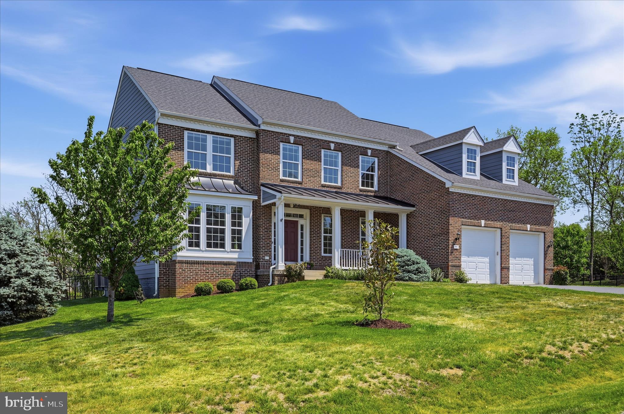 Discover luxury living in the highly sought-after community of The Point in Shepherdstown. Situated on a picturesque park-like setting, this stunning 5-bedroom, 2.5-bath move-in-ready home offers more than 4,000 square feet of beautifully designed living space and is only 10 years young. Featuring attractive and durable Brick and Hardie Plank siding, this home combines timeless curb appeal with low-maintenance living. Just minutes from historic Shepherdstown, a vibrant college town known for its locally owned shops, exceptional restaurants, annual Oktoberfest, and a university campus offering theater productions, community events, and lively fall football weekends.
Thoughtfully upgraded from top to bottom, this exceptional property showcases everything from elegant hardscaping to rich hardwood flooring throughout. The expansive main level is designed for both everyday comfort and effortless entertaining, featuring multiple living spaces, a sun-filled private home office, a formal dining room, and a spectacular chef’s kitchen complete with a gas cooktop, high-end refrigerator with a built-in water pitcher, abundant cabinetry, and an oversized pantry. A spacious morning room bump-out off the kitchen opens to an enormous patio, creating the perfect setting for outdoor dining, entertaining, and relaxing in the peaceful backyard.
Upstairs, dual staircases lead to generously sized bedrooms with ample closet space. The luxurious owner's suite is a true retreat, offering a large walk-in closet with custom built-ins and a versatile sitting area bump-out with serene views, ideal for a reading nook, fitness area, or home office. The spa-inspired ensuite bath features a custom walk-in shower, soaking tub, and private water closet.
The lower level offers incredible flexibility with a separate finished room featuring a closet and direct walk-up access to the rear patio. The expansive basement boasts soaring ceilings, abundant storage, a bathroom rough-in, and endless potential for future living space, recreation areas, or guest accommodations.
Combining luxury, space, quality construction, and an unbeatable location, this remarkable home offers everything today's buyers are looking for. Don't miss this exceptional opportunity to call The Point home.