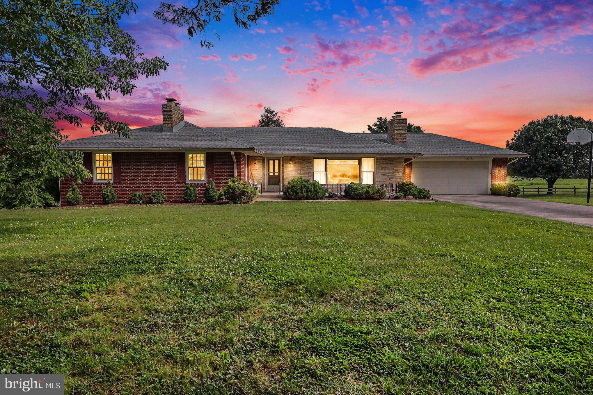 Charming brick home situated on 2.14 beautifully landscaped acres in the picturesque Town of Luray, offering breathtaking panoramic views of the Blue Ridge Mountains. Ideally located, this well-maintained home features 3 bedrooms, 2 bathrooms, a spacious kitchen and dining area, a large living room, and a screened-in back porch that's perfect for relaxing while taking in the mountain scenery.

Additional features include a 2-car attached garage, an electric storage shed, and a spacious yard with ample room for family gatherings, animals, gardening, or outdoor recreation. The large full-footprint walkout basement offers a finished office/library with an additional fireplace.  Potting room or workshop, storage areas with strong potential for future expansion or additional living space. Including a storm shelter.

With over 2,000 square feet of living space, this classic home is move-in ready. Recent improvements include triple-pane fiberglass tilt-in windows installed in 2022.  A new roof was installed in 2018, the HVAC system was installed in 2023, and a backup oil furnace that has been professionally serviced annually. R-60 attic insulation was added in 2024, enhancing the home's energy efficiency and year-round comfort. The water heater was replaced in 2021. 

The  36" Worldwide walk-behind mower conveys.

Additional pictures coming soon.