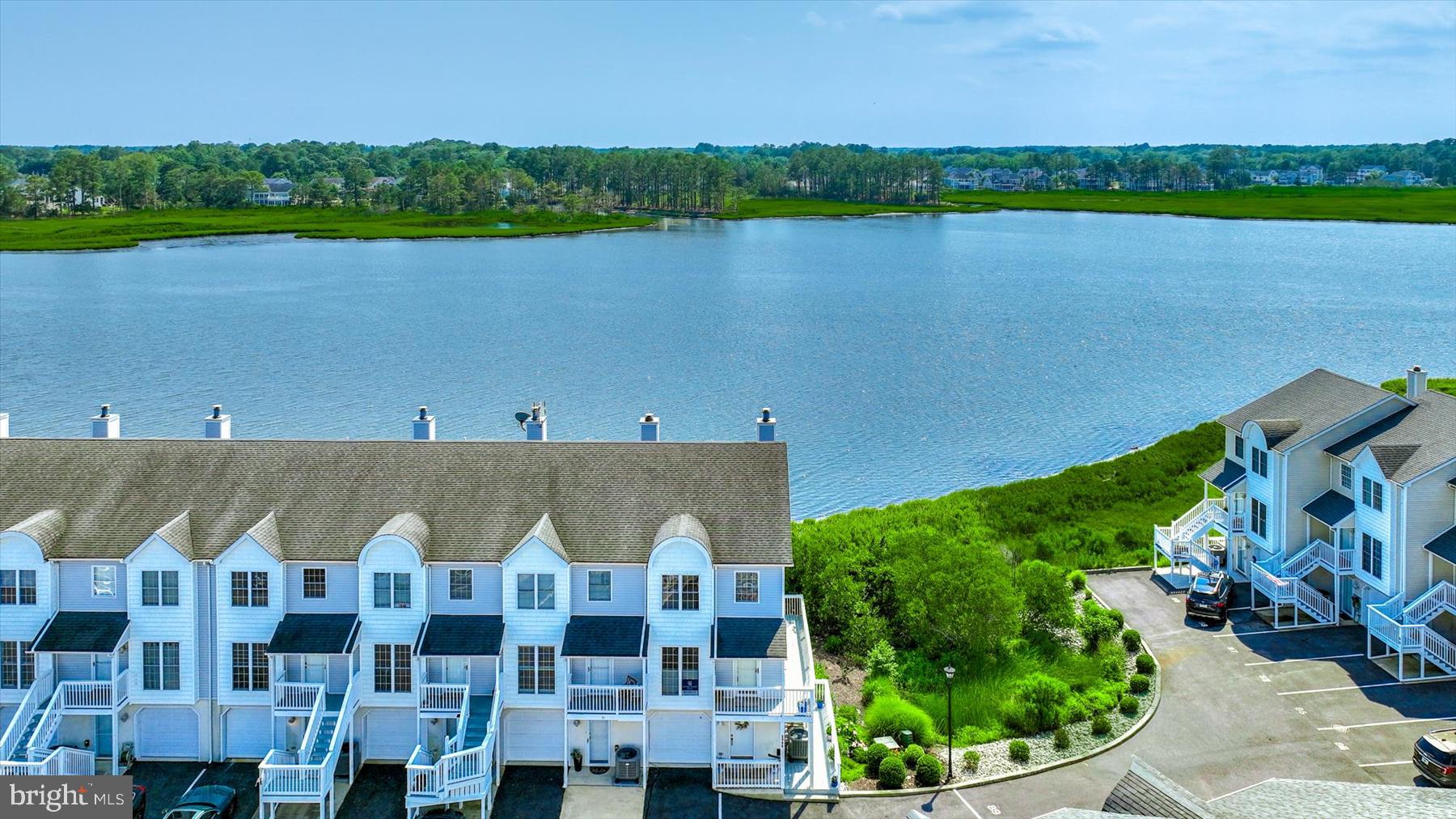 If you’ve been dreaming of a waterfront home with serene views and your own deeded boat slip, this turn‑key property delivers. This 3‑bedroom, 3.5‑bath, one-car garage home spans three levels designed for easy coastal living and a relaxed beach vibe. Just a short distance to downtown Bethany Beach, James Farm Ecological Preserve, Fresh Water State Park, Bethany Tennis Club, shopping, and local eateries. 
 The first floor features a bedroom, full bath, and a wrap‑around deck offering private water views.
The light‑filled second floor showcases a beautifully remodeled kitchen designed to maximize the stunning water backdrop. An oversized island, dining area, family room with wood‑burning fireplace, and a convenient half bath create an ideal space for gathering and entertaining. Step outside to the second‑floor deck—perfect for outdoor meals and unforgettable sunsets.
The third floor includes a spacious ensuite guest bedroom, hall laundry, and a generous primary suite with three closets, an ensuite bath, and its own sun‑drenched private deck. It’s an inviting spot to start the day or soak up a little afternoon sun.  
Offered fully furnished and move‑in ready, this home makes waterfront living effortless. Your waterfront lifestyle awaits.