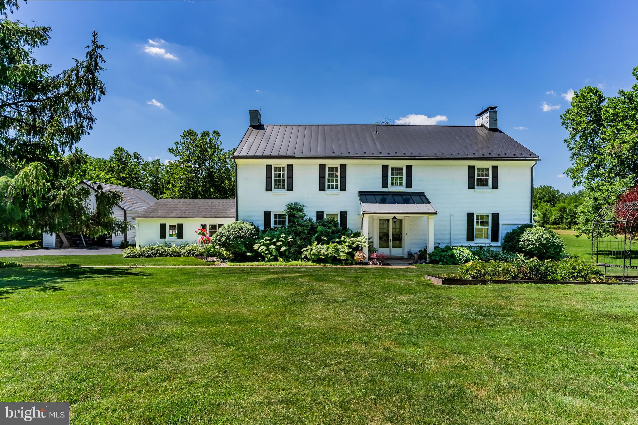 Welcome to a slice of history & natural beauty - a picturesque estate on 7.73 acres along the famous Yellow Breeches Creek! Properties like this don't come available often - so don't miss your chance!  This exquisite federal-style brick home, built in 1798, offers a rare opportunity to own a piece of local heritage while enjoying the tranquility of rural living.  The beautifully preserved home features random width pine floors that exude warmth and character.  Inside, you will find a large open kitchen / dining / family room area with modern updates and a gorgeous brick fireplace with wood stove perfect for hosting large gatherings!  A  den with fireplace and main level laundry round out the main level.  Upstairs you will be pleasantly surprised with a large primary suite with balcony access and oodles of closet space! 3 additional bedrooms, full bath and a cozy library complete the upper living area.  A brand new metal roof (2025), new oil furnace (2026), and 7 new split  AC units (2025) assures comfort and reliability for years to come!  Outside is where the magic happens!  A large bank barn with 10 stalls, tack room with electric & water, corn crib, 4 paddocks and a riding ring make this a dream come true for horse enthusiasts!  2-acre area enclosed by an invisible fence offers a safe space for your pets to roam freely.  With 600 feet of Yellow Breeches Creek frontage right in your backyard, this is a fly fisherman's DREAM!  Tucked away on a quiet cul-de-sac in Dickinson Township, this property offers the best of both worlds - secluded country living with easy access to local amenities, schools, and shopping.  Whether you are looking to embrace the equestrian lifestyle or simply seeking a peaceful country retreat, this home is ready to welcome you. Schedule your private showing today and discover all that this enchanting property has to offer!
