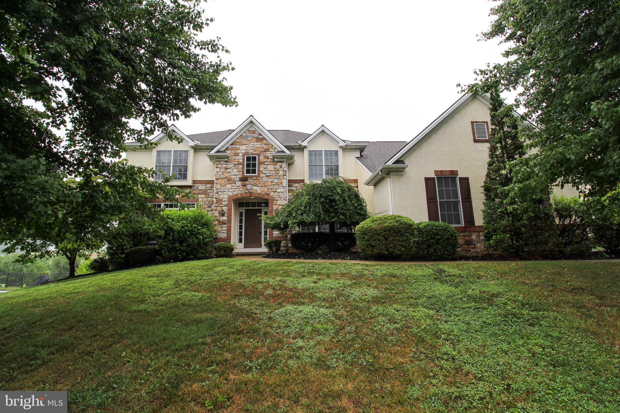 **Client just updated the central air system by replacing one of the units and putting new parts in the other one**** Clients offering a $5k credit for deck

Welcome to this luxurious and spacious 5-bedroom, 4.5-bathroom home, boasting 5,625 square feet of elegance. Nestled on a large, lovely backyard, this home features built-ins, carpet, and a combination kitchen/dining area. Enjoy formal dining in the separate dining room, or a cozy meal in the country-style, eat-in kitchen. The primary bath includes a soaking tub, stall shower, and tub shower. The home is adorned with recessed lighting and wood floors throughout. 
Relax by the brick fireplace with glass doors and gas/propane options. Modern stainless steel appliances, including a built-in microwave, dishwasher, oven/range - gas, and refrigerator, complete the kitchen. The main floor laundry adds convenience to this accessible home. This property exudes luxury and offers ample space for all your needs.