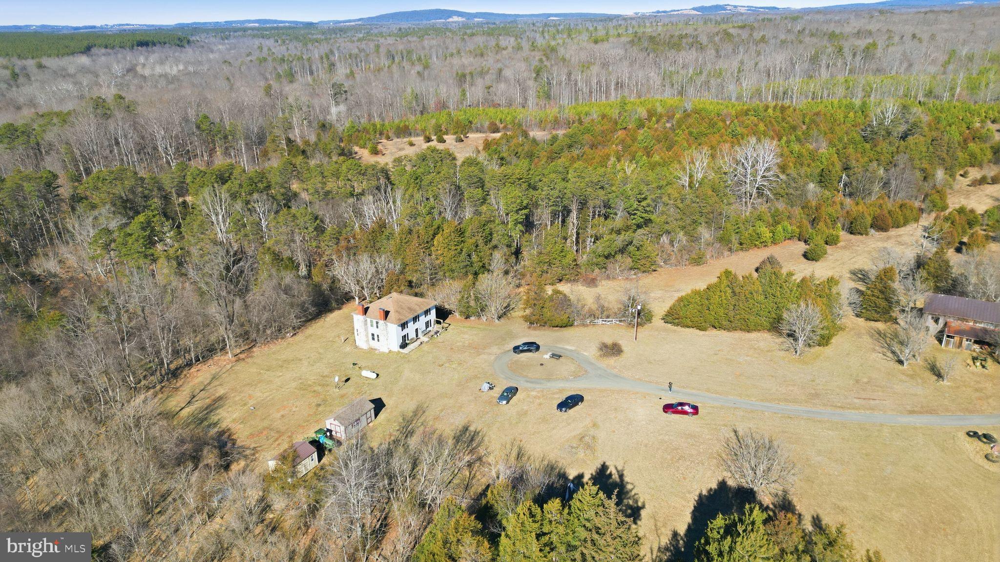Agricultural Investment: 98-Acre Farm in Orange County, Virginia

Located in the productive agricultural heartland of Orange County, Virginia, 15284 Poplar Road presents a compelling opportunity for farmers, timber investors, and agribusiness owners seeking a versatile 98-acre property with significant operational, income, and long-term asset potential. This expansive farm is strategically situated approximately 75 miles from Richmond, Virginia, and 85 miles from Washington, D.C., offering unparalleled logistical advantages for accessing major metropolitan markets and distribution hubs, while retaining the essential rural character of Central Virginia.

Productive Land and Timber Resources:
The property encompasses approximately 28+ acres of established loblolly pine, representing a valuable, near-term timber resource. This mature stand offers immediate harvest potential, providing a substantial revenue stream for timber operations or a strategic asset for future forest management. The remaining acreage consists of open, gently rolling farmland, characteristic of the region's fertile soils. Orange County's agricultural lands are known for supporting diverse operations, including row crops, forage production, and livestock grazing, with common soil orders like Ultisols indicating suitability for a range of agricultural endeavors  . This land offers a robust foundation for various farming practices.
Flexible Zoning for Agribusiness and Diversification:
Zoned Agricultural, the property benefits from a broad spectrum of matter-of-right uses directly supporting agricultural enterprises and diversification strategies. This includes traditional farming operations, as well as burgeoning opportunities in agritourism, which is a significant and growing economic contributor in Virginia. The zoning also permits short-term rentals and bed and breakfast establishments, offering avenues for supplementary income through farm stays or event hosting. This regulatory flexibility empowers owners to innovate and adapt their business models to market demands.

Operational Efficiency and Market Access:
The farm's prime location provides critical access to consumer markets and agricultural supply chains. Proximity to Richmond and Washington, D.C., facilitates efficient transport of produce, livestock, or timber, reducing logistical costs and expanding market reach. This strategic positioning is ideal for operations focused on direct-to-consumer sales, farm-to-table initiatives, or large-scale distribution.