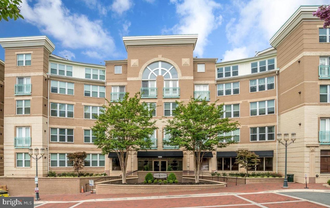 Steps to shops, bars, restaurants, & activities in Reston TownCenter. 2 assigned garage spots! Recently replaced HVAC & hot water heater. Amenities: gym, business center, concierge, game room, pool, & party rooms. Quiet interior condo w/ balcony that faces manicured courtyard/pool. Updated Kit w/ granite, GE SS apps, 42" cabs, & marble flooring. Bonus custom dry bar addition w/ granite, beverage refrigerator & storage pantry. Gas FP. Custom closet organizers in BR. Newly updated bathroom. Use link for application