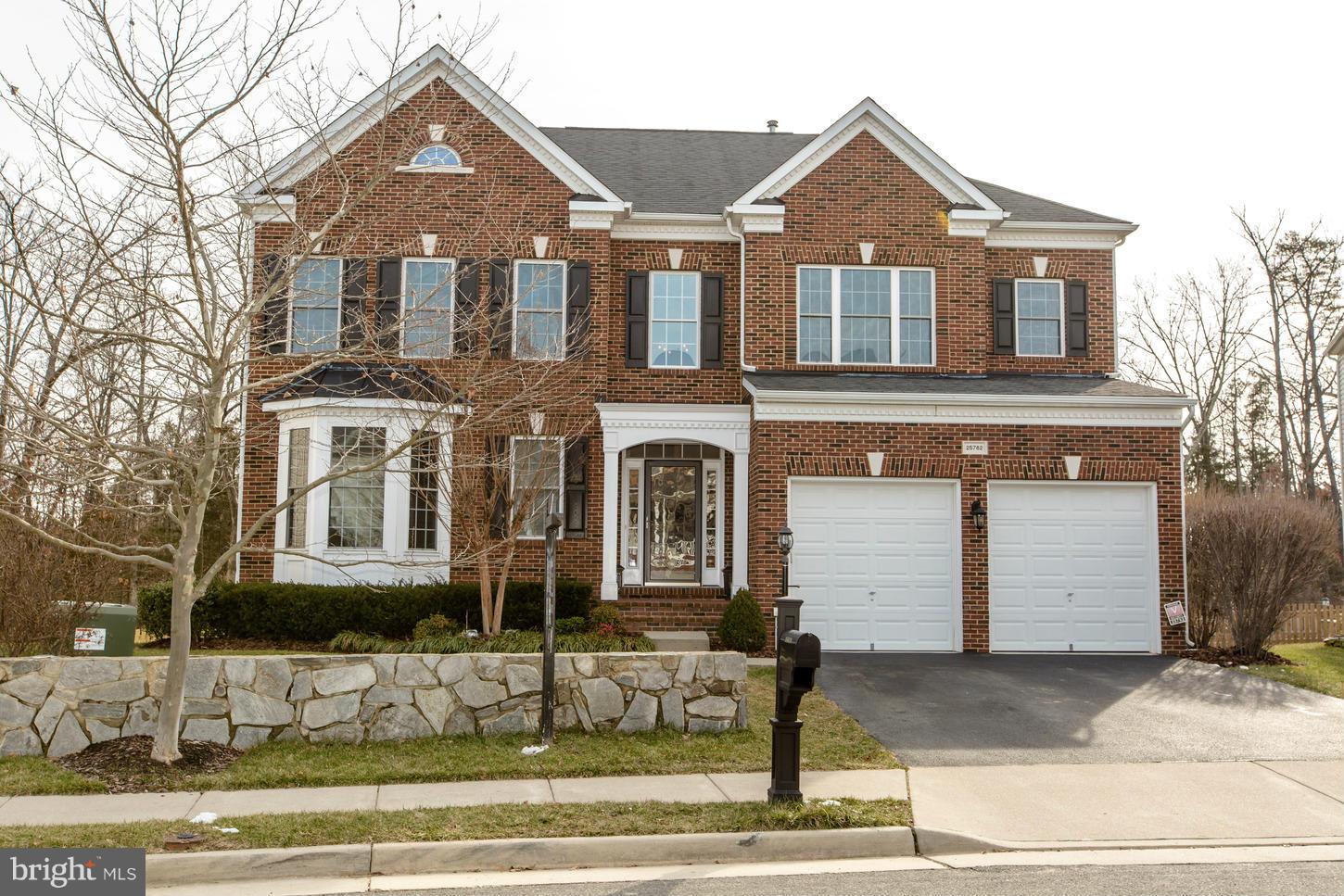 Gorgeous Brick Front home with a perfect 10 backyard.  Backs to trees w/ screened in porch.  Gourmet kitchen w/ granite & open to family room for easy entertaining.  Large living/dining rooms.  Office w/ custom bookcases.  Master suite w/ sitting area, 2 walk in closets & custom bathroom. Finished bsmt w/ work out room, bedroom area , full bath, custom bar, rec room and walks out to backyard.