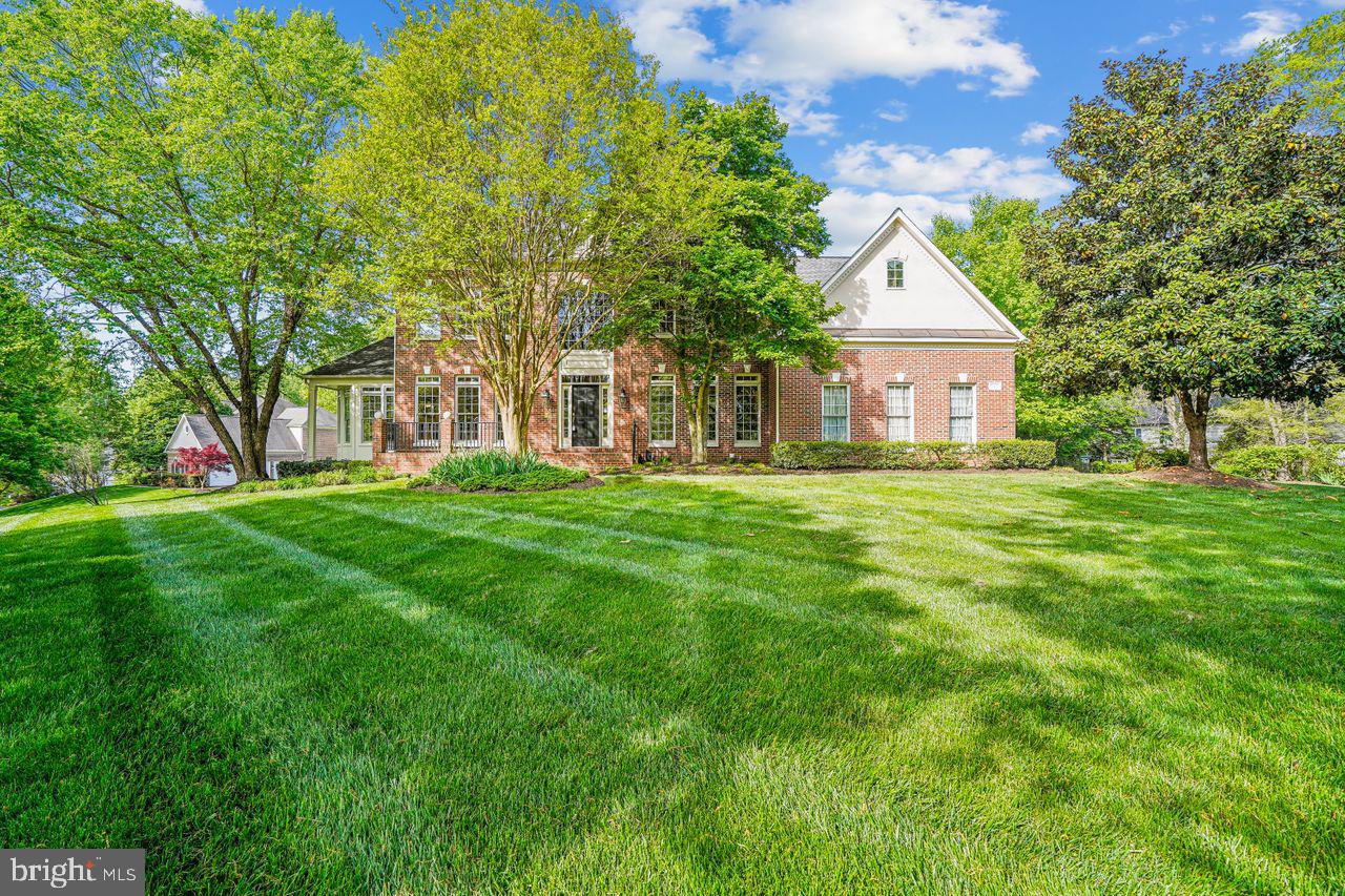 This beautiful, light-filled home on a corner lot in the Woodland Estates Subdivision in Vienna has everything you are looking for.  As a Winchester model home, it comes with all the upgrades such as 3-sided brick exterior, 2 solariums, and 4 rooms in the basement for exercise, guests, playroom, and all your storage needs.  This house boasts a lovely exterior, high ceilings, fresh paint, new carpet, new led ceiling lights and fans, new washer/dryer, and over 7000 sq feet of space to make your home. First floor has an updated kitchen with new appliances, counters and backsplash attached to sunroom full of windows looking out over the meticulously landscaped backyard, newly refinished deck and hardscape.  A large family room with vaulted ceiling and fire place is open to the kitchen making it the perfect spot for spending time with family.  A formal living room, dining room, and music room provide the perfect space for entertaining.  The second level has a huge main bedroom with two walk-in closets and the fully-renovated ensuite bathroom of your dreams. Three additional spacious bedrooms, two baths, ample closets, and plush carpet provide a luxurious living space for everyone.  A fully-finished, walk-up basement has an additional bathroom and multiple rooms that can be configured to suit your needs. The home is convenient to Reston Town Center, only 15 minutes to Dulles Airport, and close proximity to exciting venues including Nova Wild, Meadowlark, and Lake Fairfax Park.