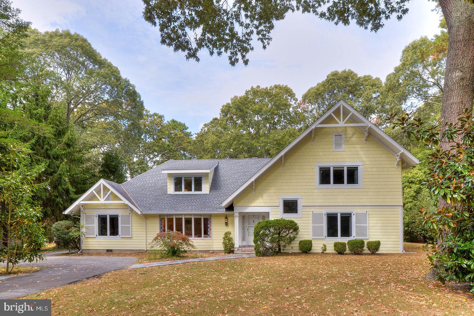 If you are seeking a community that offers lush landscaping, beautiful mature trees, spacious lots and stately custom homes at every turn, look no further. The beautiful seaside community of Henlopen Acres is truly second-to-none. With a private "members only" beach club, private beach, community marina and home to Rehoboth Art League's galleries and historic campus, this community leaves little to be desired. 25 Rolling Road is your opportunity to become a part of the esteemed Henlopen Acres lifestyle. This home is situated on approximately a half-acre partially wooded parcel, just 2 blocks from the beach and only a few short blocks from Rehoboth's boardwalk and amenity rich downtown area. Originally built in 1967, this beautiful home was renovated in 1999 and has been lovingly maintained.  This classic yet ultra-functional 5 bedroom, 4.5 bathroom floor plan features space for everyone creating the ideal beach retreat or full-time residence. Features include oak hardwood floors, floor to ceiling windows flooding every room with natural light, formal living and dining areas, gourmet kitchen with granite prep island and breakfast bar, keeping room with wood burning fireplace, enormous family room, first floor laundry area and two first level bedrooms complete with en-suite baths. The second level features another master suite complete with a private bath and 2 additional bedrooms. In addition, this home includes an abundance of storage with a 2-car garage, walk-in pantry, numerous hall closets, custom closets in every bedroom and walk-in attic space. Sold tastefully decorated and furnished, this home is a must see!