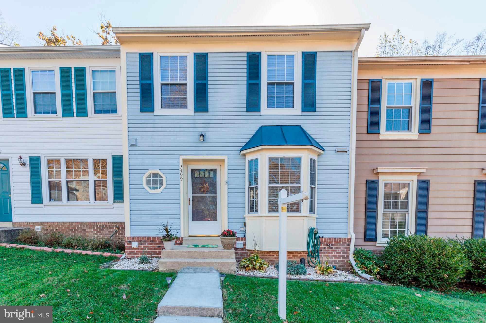 ***New roof to be installed prior to settlement**Almost 2000 sq ft townhome backing to wooded common area.  This one wont last long with its many updates & features to include: updated kitchen with granite & undermount sink, stainless steel appliances, hardwood floors in foyer / kitchen/ DR & stairs,  coffee bar with pendant lighting, fresh paint, walk in  bay window, updated master bath with tile flooring & tile surround shower,  walk out basement with recessed lighting & molding lights, corner fireplace, lots of basement storage areas, front load washer dryer with custom folding area, work shop/ craft nook with custom wood top, under counter lighting and storage cabinets.  All of this backing to private wooded common area with winter views of the water from your deck. Fully fenced rear yard with patio area under the deck.  Parking at your door step, community pool , community dock and play areas.