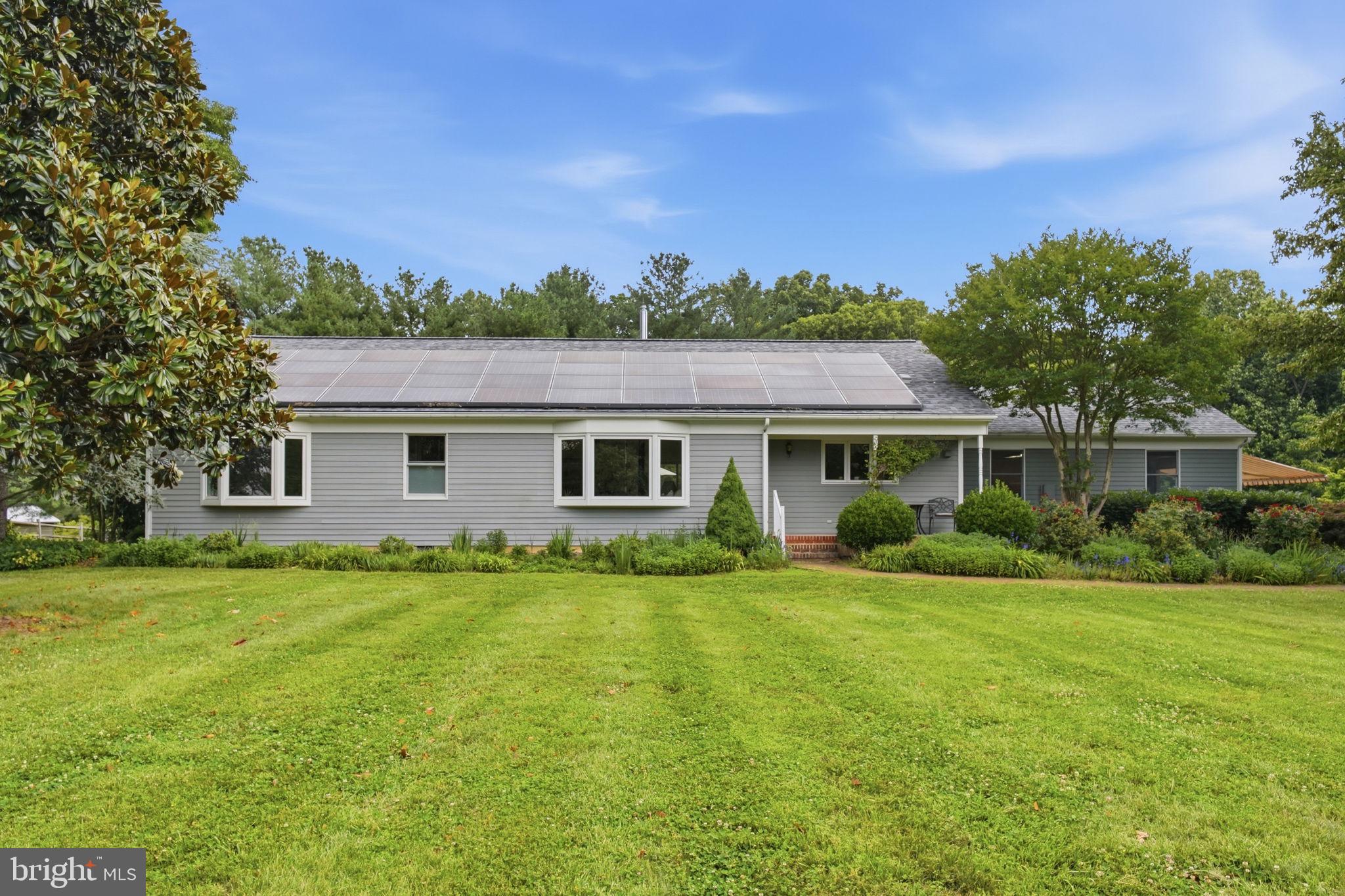 Light-filled home with glowing wood floors, exposed beams, skylights, and open living space. This one-level home is nestled on just under two acres! The expansive yard offers room for many activities and provides scenic views from the home. Inside, the open living space is bright and airy, with skylights, bay windows, and vaulted ceilings with exposed beams. The large kitchen has beautiful updated granite countertops, a large pantry, kitchen island with seating, and ample cabinet space. From the dining room you can explore the raised deck with a hot tub! Or enjoy meals on the screened porch, finished with water and electricity. This one-level home boasts 3 spacious bedrooms and 2.5 bathrooms. The primary bedroom has a walk-in closet and opens to a sun-filled studio or office space, which has access to the raised deck. 
There is an attached two-car garage with ample storage space, which could also make a great workshop.
Under 15 minutes to downtown Chestertown and less than an hour to Middletown DE.

Recent updates include: 
-Refinished hardwood floors throughout home
-Granite countertops in kitchen
-Updated kitchen appliances
-Water treatment system
- & more!
Solar leased through Tesla