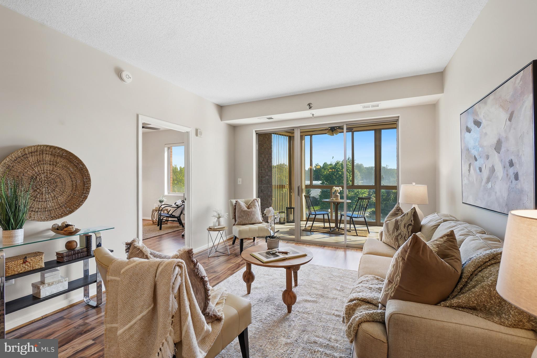 Gorgeous condo in Vantage Point West, one of the best buildings in Leisure World, a 55+ active adult community that lives like a resort!  Only steps from the elevator, this unit offers loads of upgrades, such as laminate wood floors and ceramic tile throughout, gorgeous granite countertops and tile backsplash in the kitchen, and a fresh color palette that brightens the entire apartment! The primary bedroom suite is on the opposite side of the unit from the 2nd bedroom which affords maximum privacy, and both bedrooms include an ensuite bath. There are plenty of closets throughout, a secured storage cage, and a washer/dryer. Vantage Point West is one of the most popular and best-managed buildings in the community! Clubhouse II is next door and includes the indoor pools, awesome fitness center, billiards and ping pong rooms, auditorium and pickle ball courts. Community amenities also include an 18-hole golf course, 2 restaurants plus a pub, an outdoor pool and lanai, a grand ballroom, art studio, woodworking shop, library, MedStar Health Center and community garden across the street, 24-hour security and so much more! This condo is an unbeatable value in today's market!