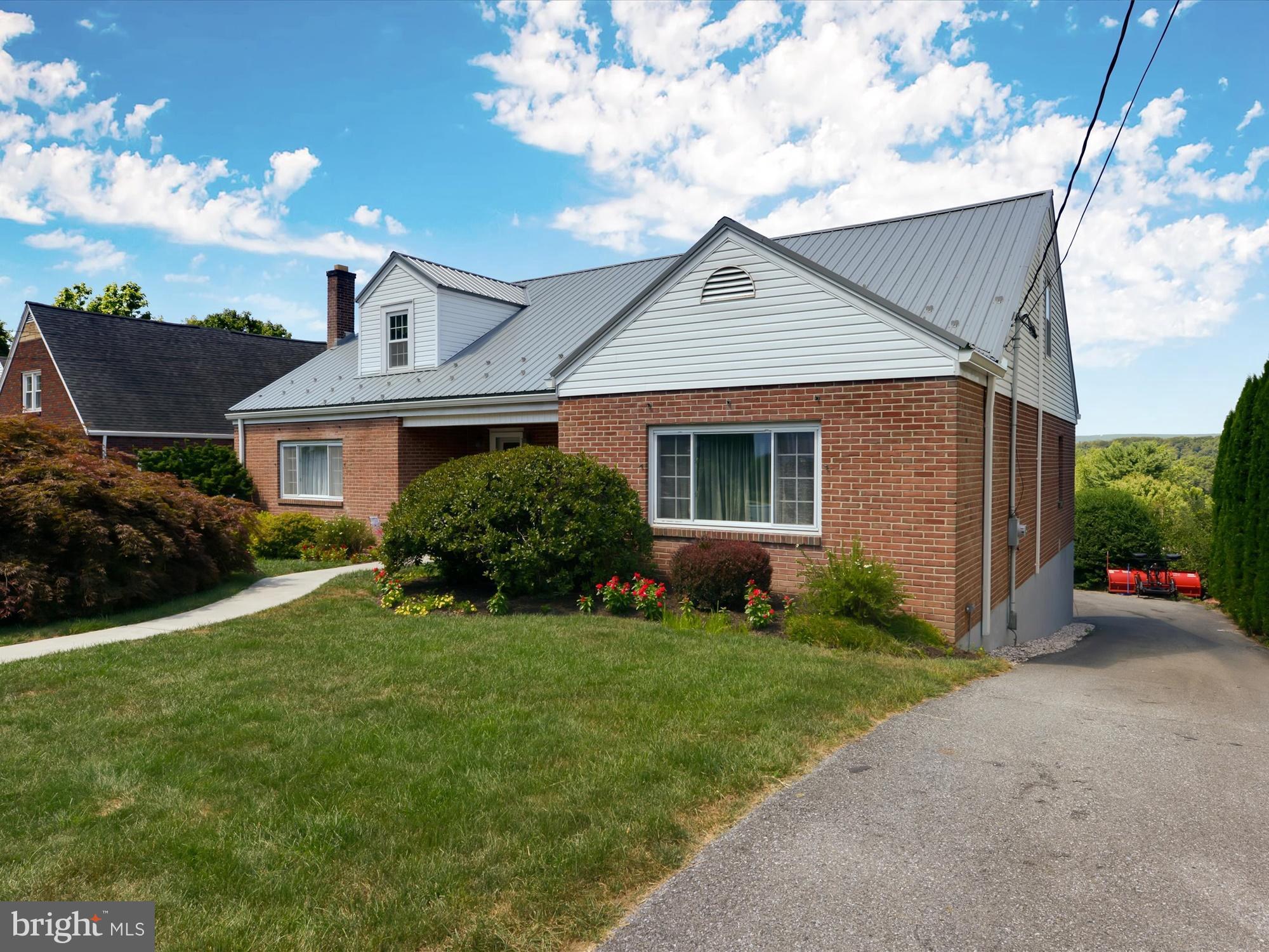 Totally remodeled 5-bedroom, 3 bathroom home on Mahantongo Street. Don't let the outside deceive you.  Home is much larger than it appears from the outside. Kitchen has moulded sink, granite countertops, pull-out pantry.  Large foyer when entering,  Hardwood floors are oak.  Sunroom and Deck were built in 2013.  Metal roof in 2010 with a 40 year warranty.  New 4" gutters.  Large dining room with big picture window.  Bathroom has Jacuzzi.  Full finished basement with granite bar with French door to outside. Outside deck and patio. (Great for entertaining.)   The laundry is located on the lower level in the full bath. NOTE:  Tax ID# 68-47-0089, additional .12 Acres located behind home at 0 Norwegian Street, included with sale.