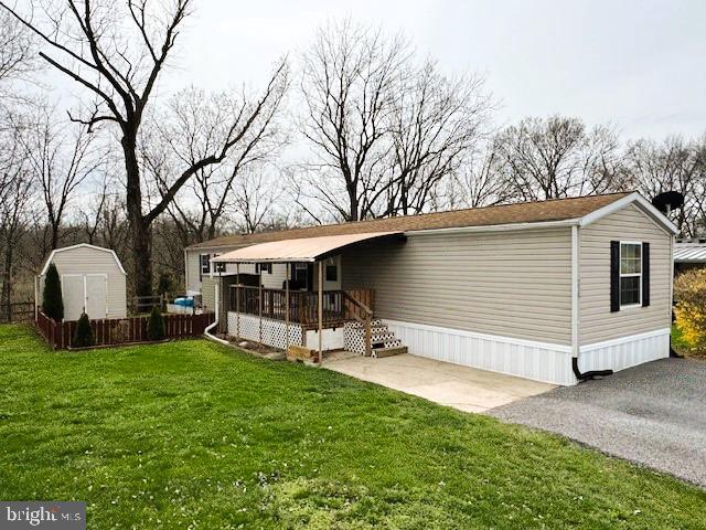Discover comfort and affordability in this well-maintained one-story mobile home nestled in a peaceful park setting backing to woods *Open floor plan featuring spacious Living Room, Dining Area & Kitchen with breakfast bar *3 Bedrooms & 2 Full baths including Primary Bedroom with double closet & private bath *Convenient first floor laundry with washer & dryer included *Outdoor living at its best with covered deck leading to wonderful fenced yard & two great sheds! Be the first to see this home to make it yours with quick possession possible too!
